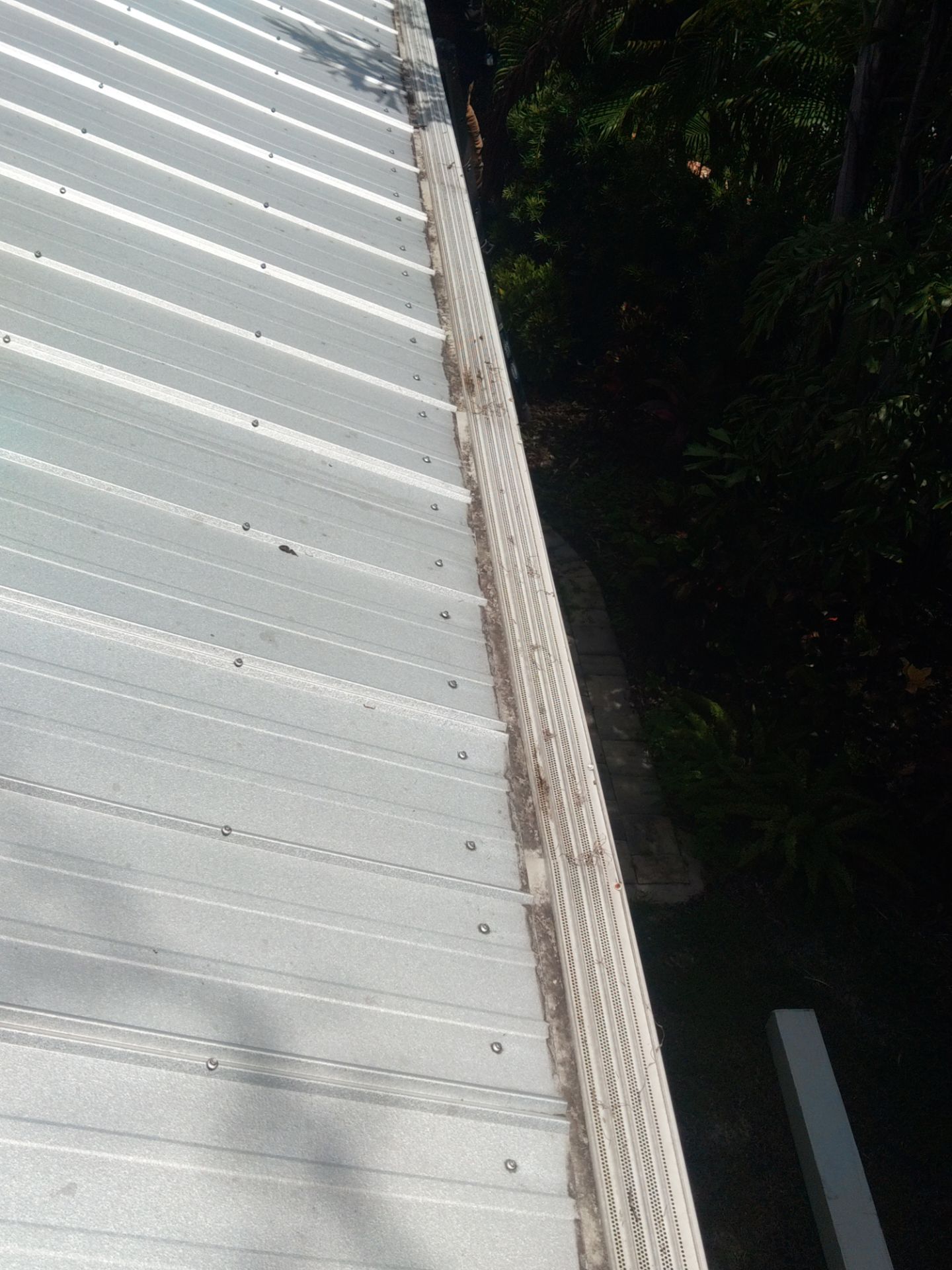 Gutter guards installation combined with gutter cleaning in Sarasota, FL by Gutter Professors