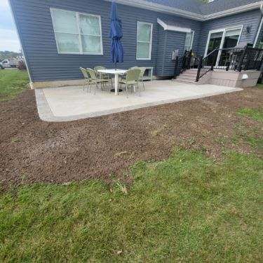 Outdoor Living- Deck and Concrete by Ivy Lea Construction