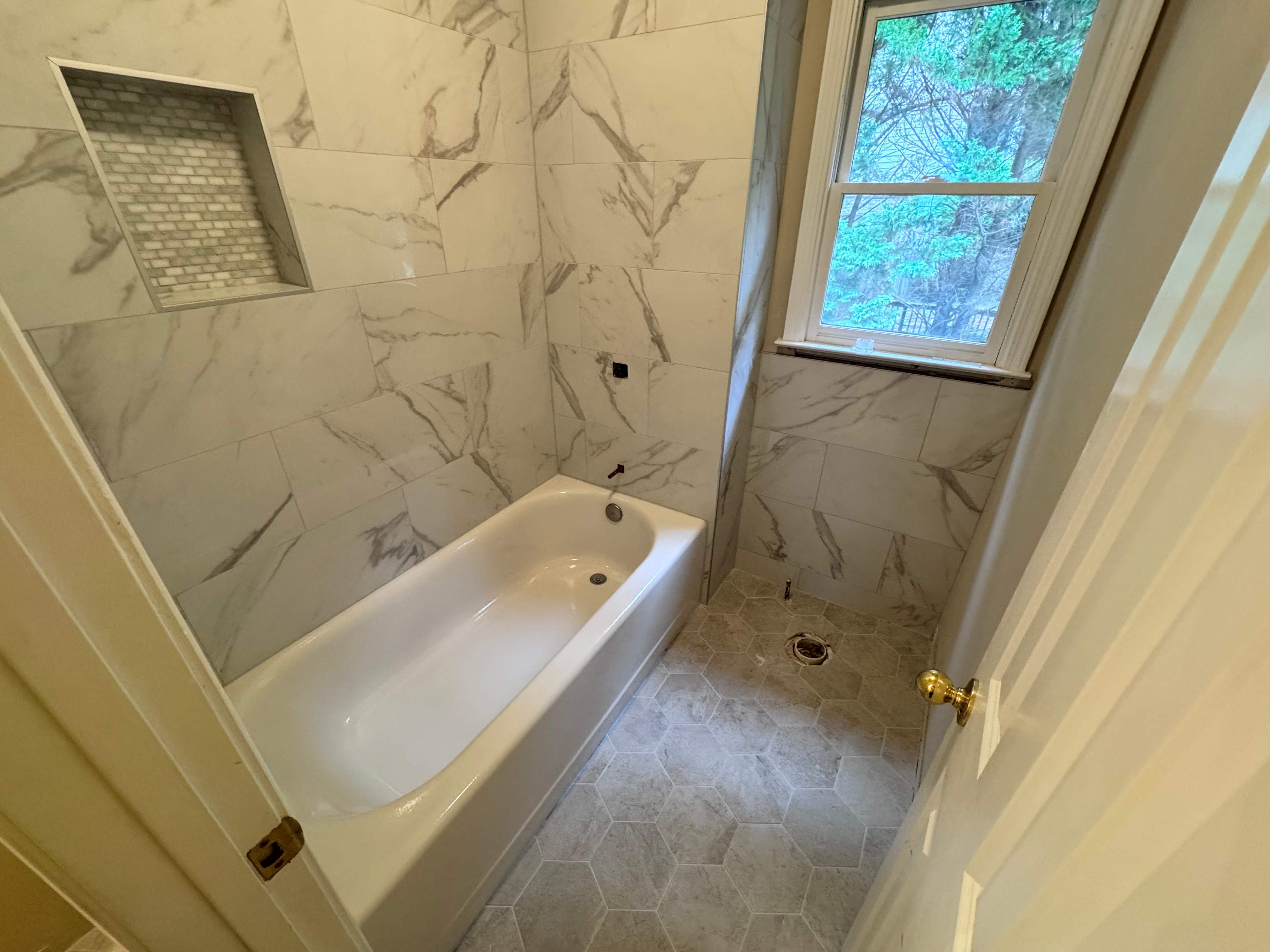 Tub and floor tile installation by Prudencio
