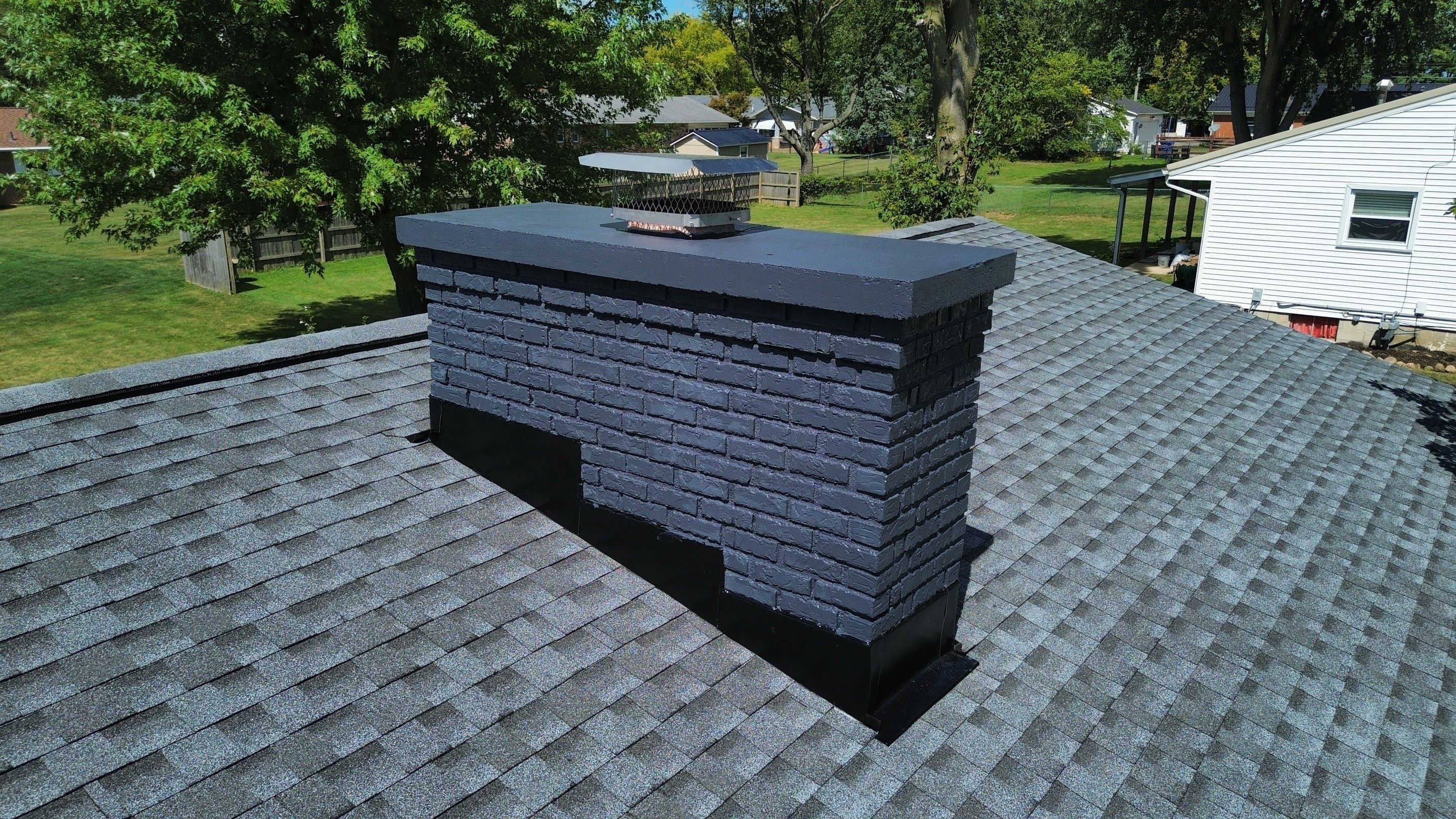 Roof Replacment, Chimney crown  by Know-A-Guy Roofing & Exteriors 