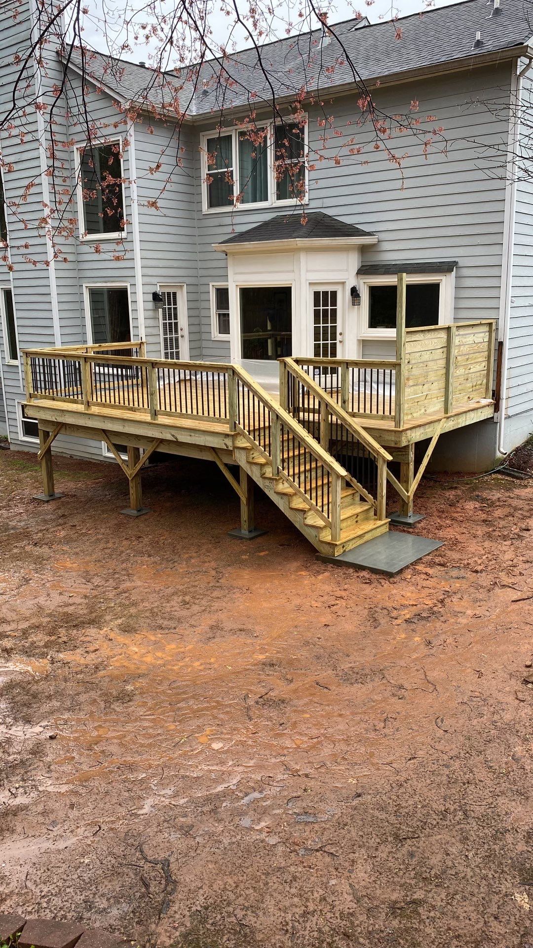 Elevated Deck Replacement with Black Metal Railings in Johns Creek by Swift Home Renovations