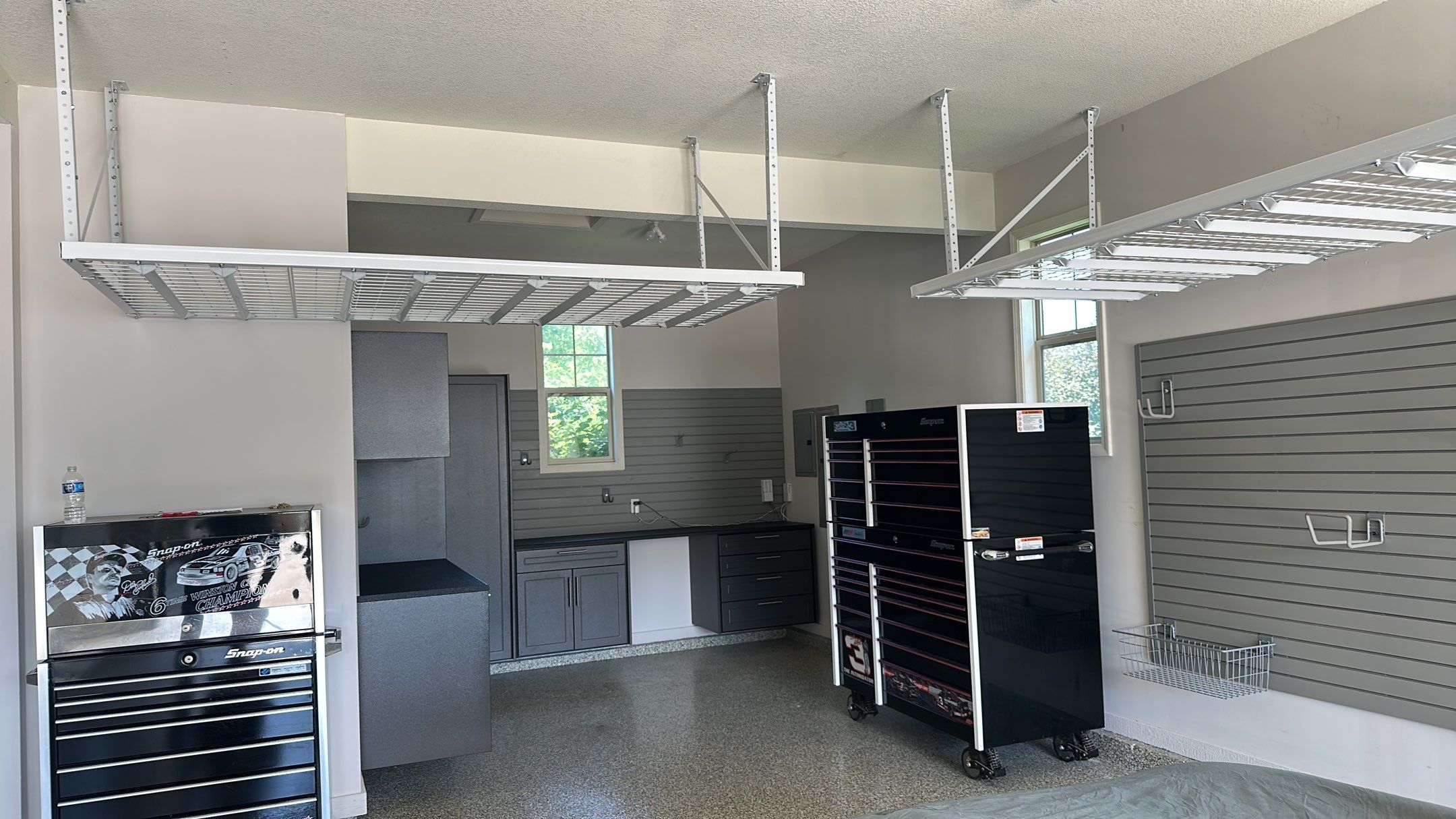 Lori H. upgrade her garage with cabinets and overhead racks by Banner Garage