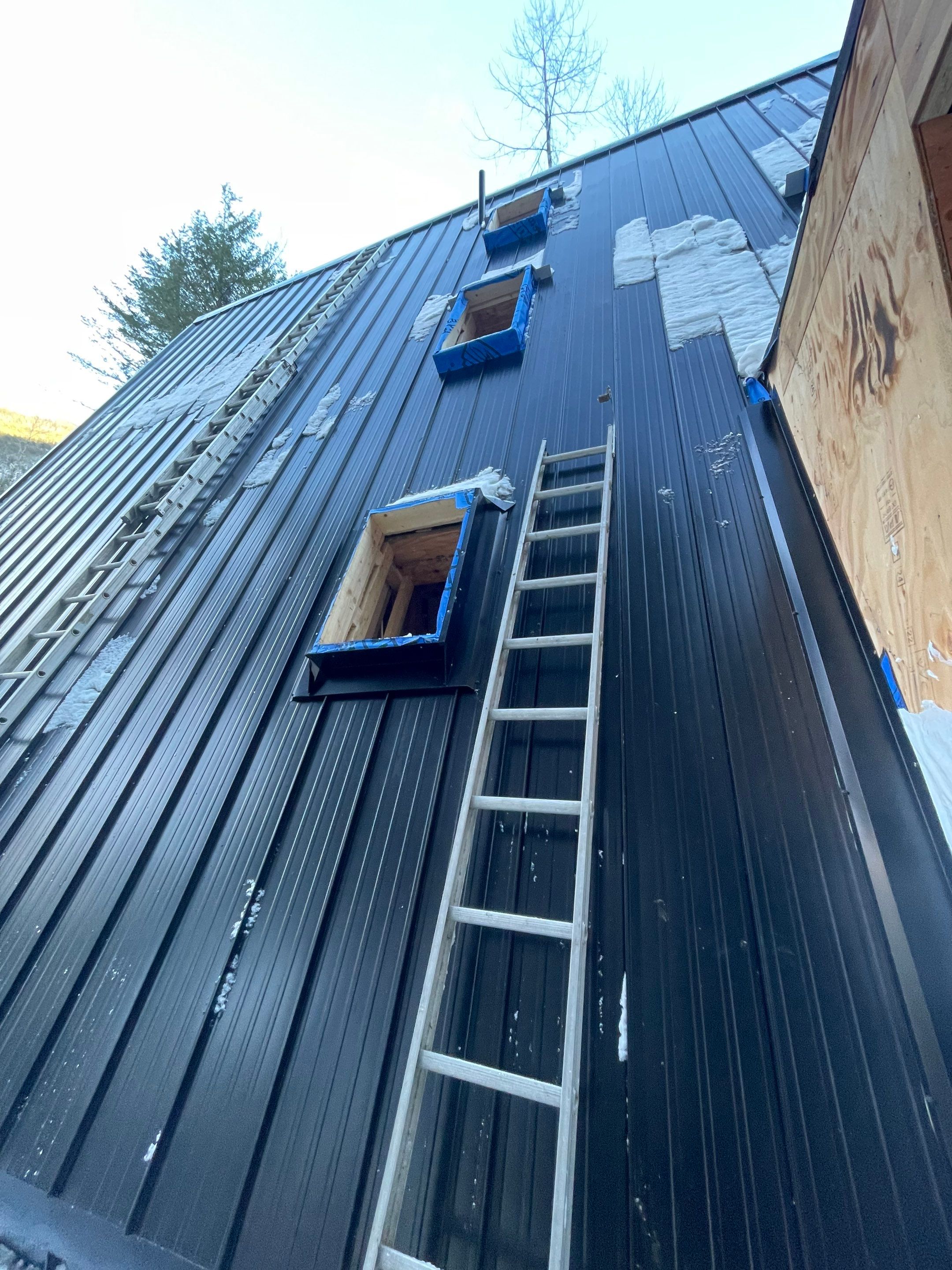 Residential Roofing Installation using 12" Prolok metal  by Top Notch Roofing Inc