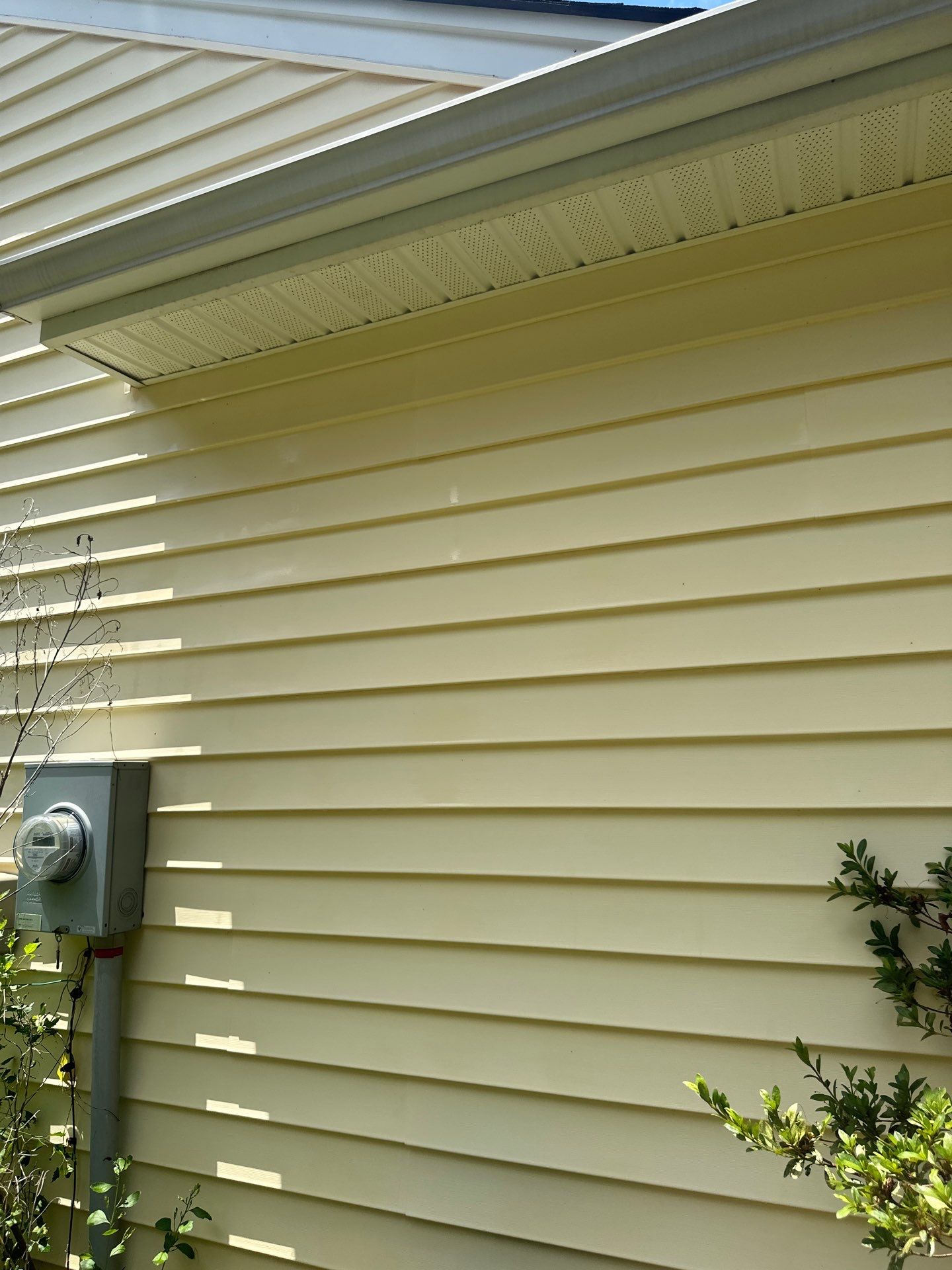 the pressure washing company is cleaning the exterior siding of a house the service includes washing the vinyl siding to remove dirt mould and mildew buildup which can accumulate over time due to weather and environmental conditions high-pressure water is used to clean the surface and restore the appearance of the home the service may also extend to cleaning the soffit and facia boards beneath the roof overhang for a thorough exterior clean