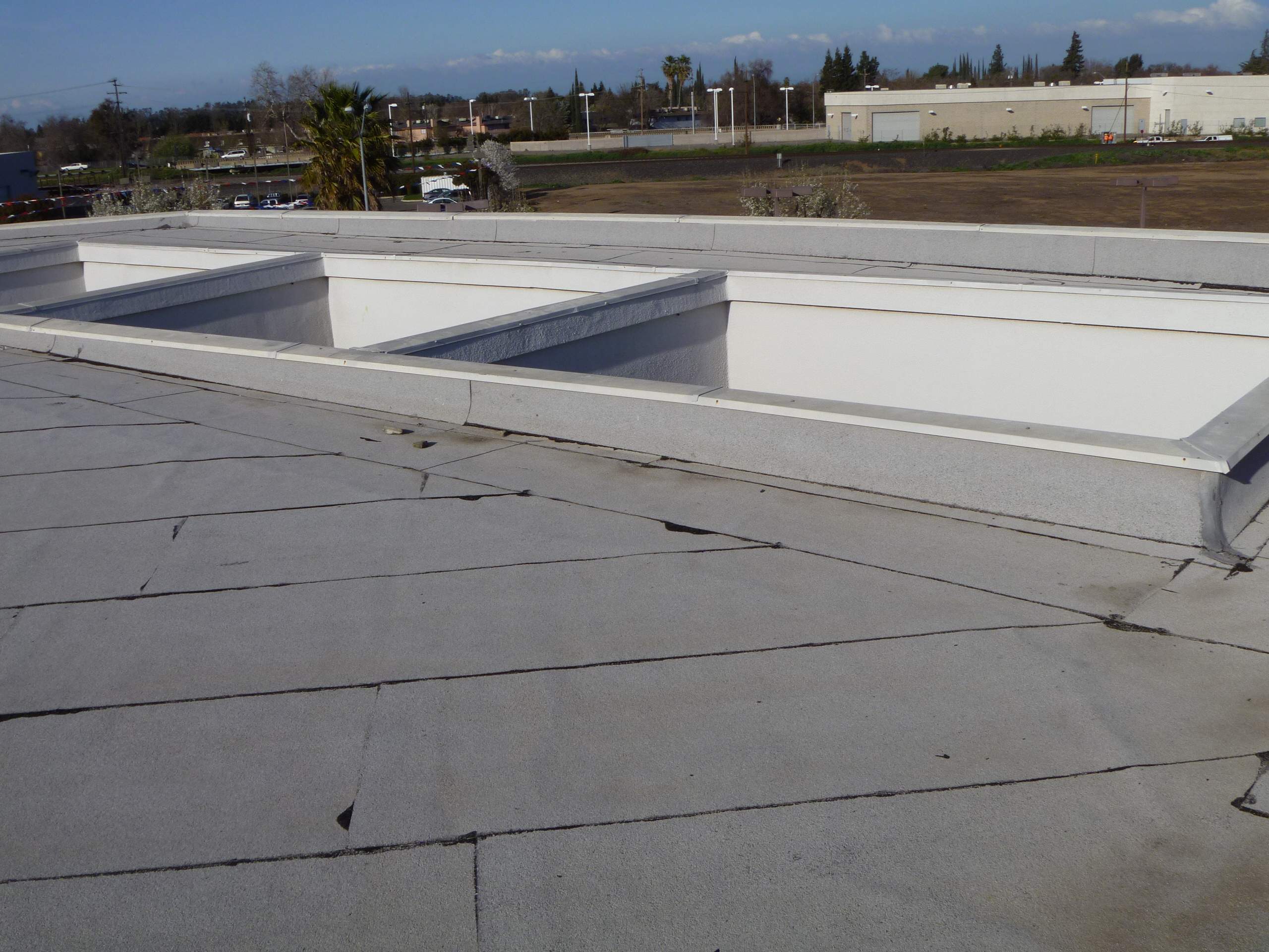 Commercial Roofing Installation using Spray foam and Conklin Benchmark/PUMA XL 18 yr warranty coatings by Straight Edge Roofing Inc