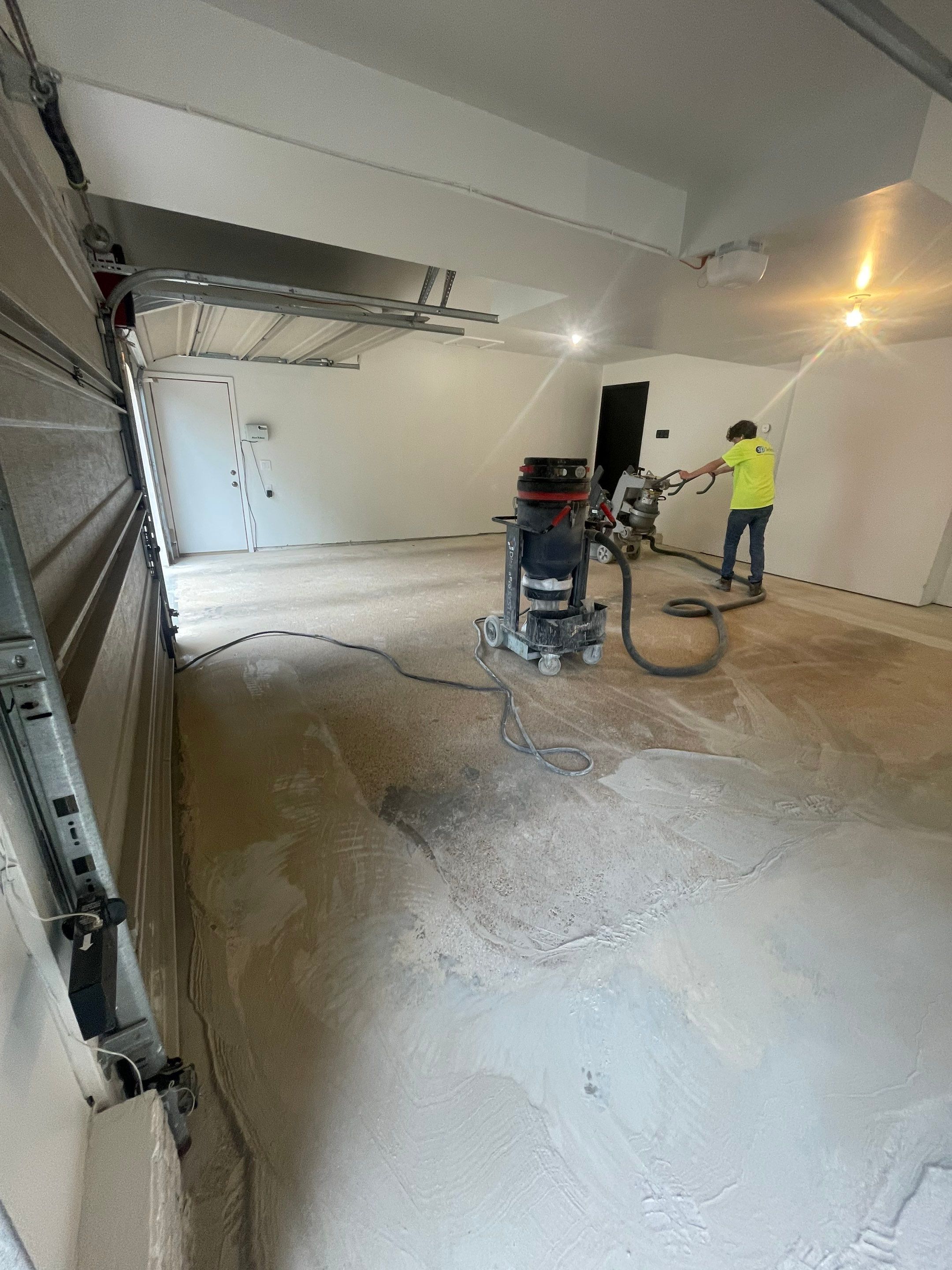 Gray Speckled Epoxy Garage Floor Coating in Sioux Falls by Select Painting, Coatings & Garage Cabinets