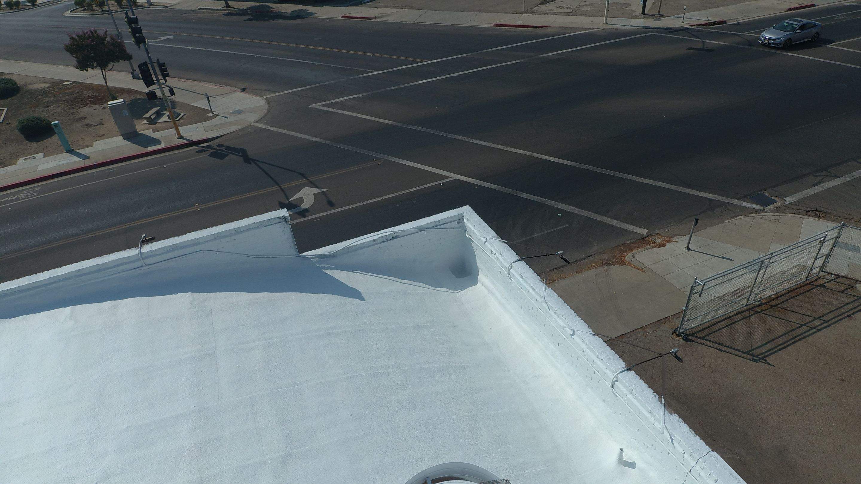 Polyurethane foam roof refurbish and recoating by Straight Edge Roofing Inc