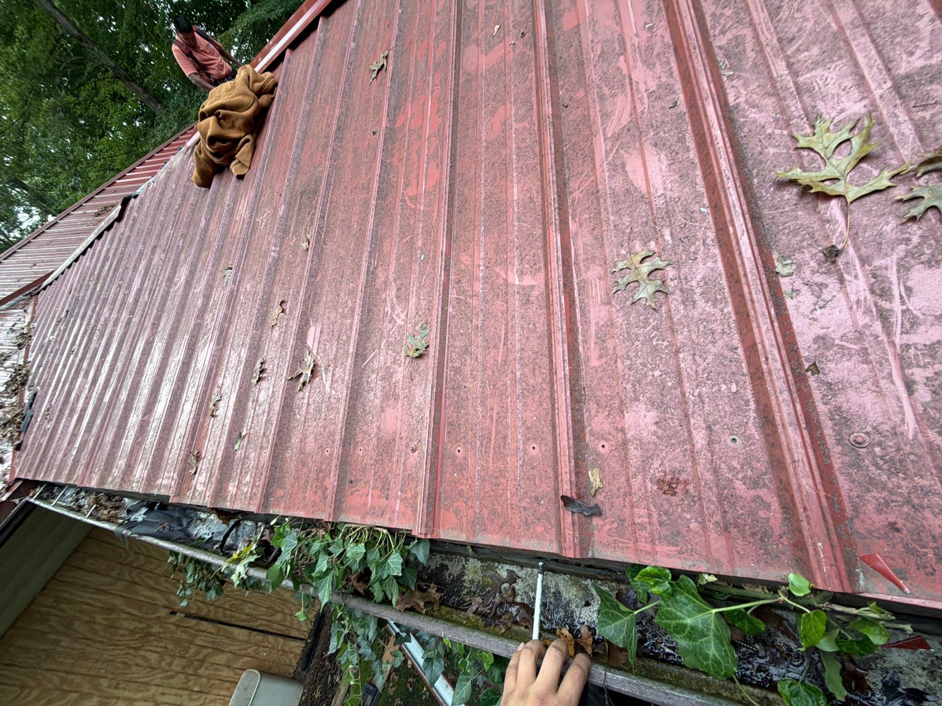 Red Metal Roof Restoration and Wood Fascia Replacement in Barboursville by Cade Construction