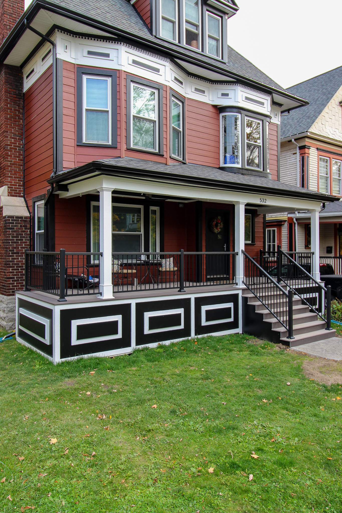 Exterior Renovations- Siding, Stamped Concrete, Porch, and Railings by Ivy Lea Construction