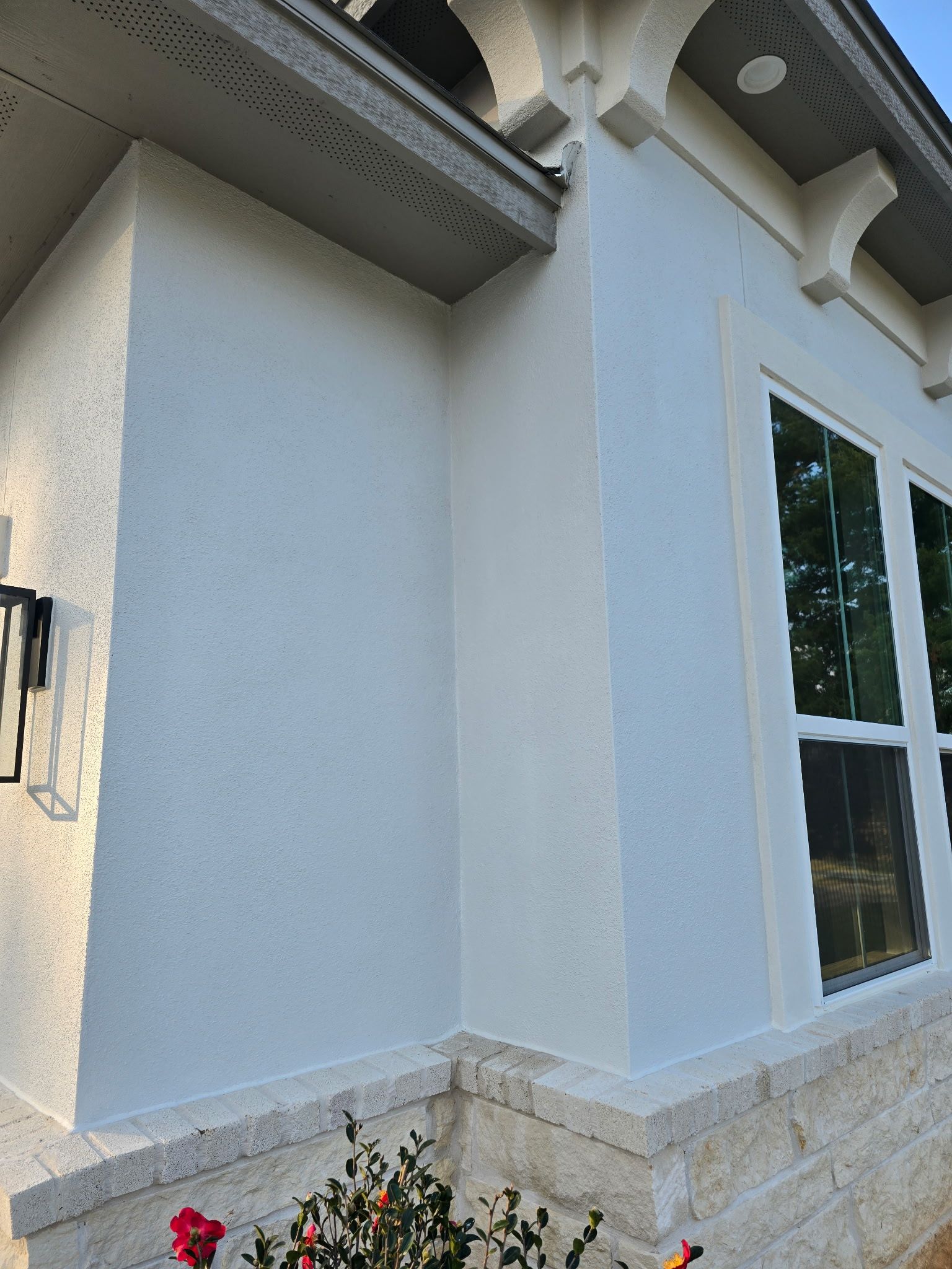 Conroe Elegance: Stucco, Foam Corbels, and Natural Stone Accents. by Apex Conventional Stucco Llc