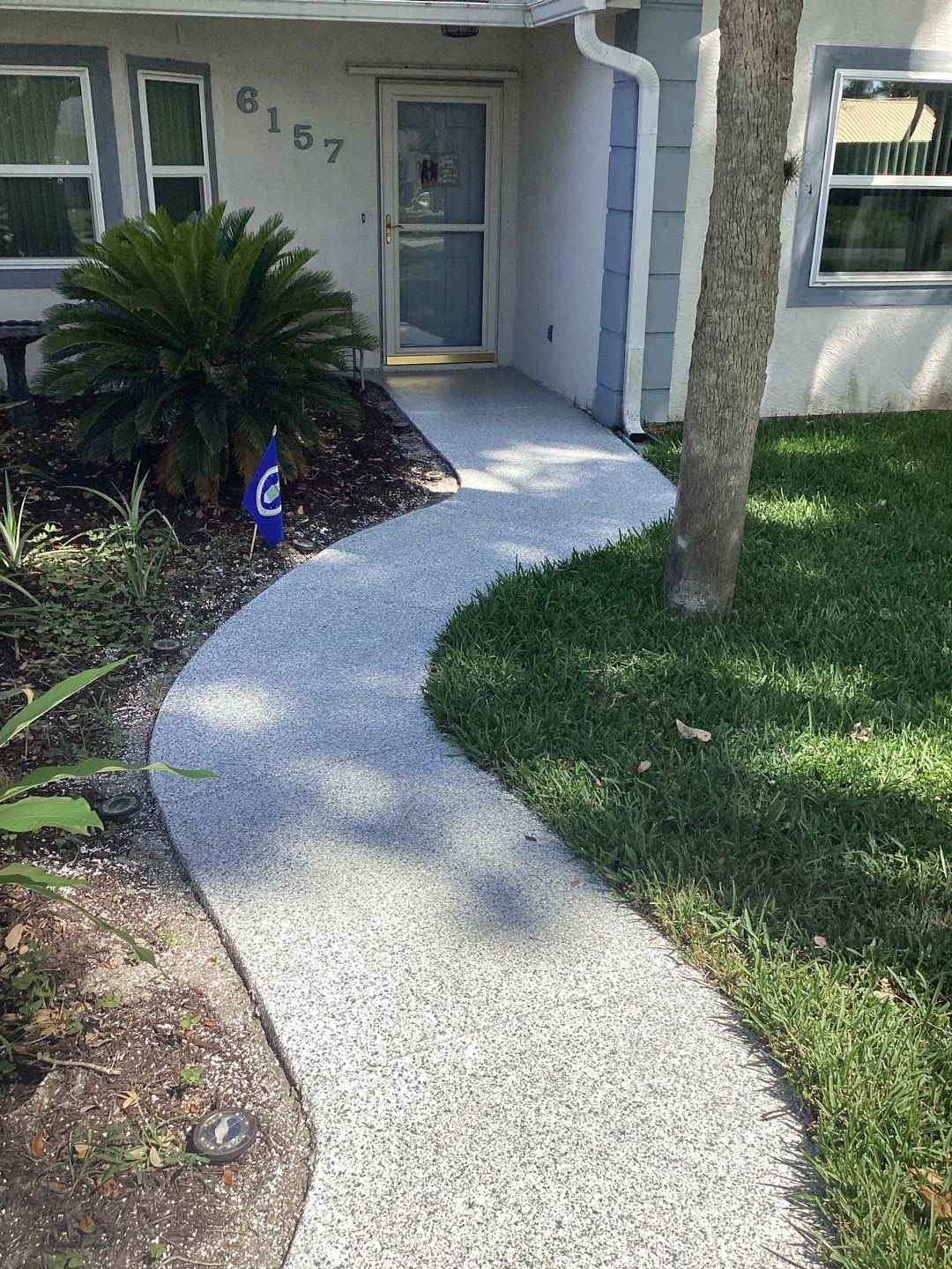 Driveway and Garage using Tidal Wave by Amvet concrete coatings llc