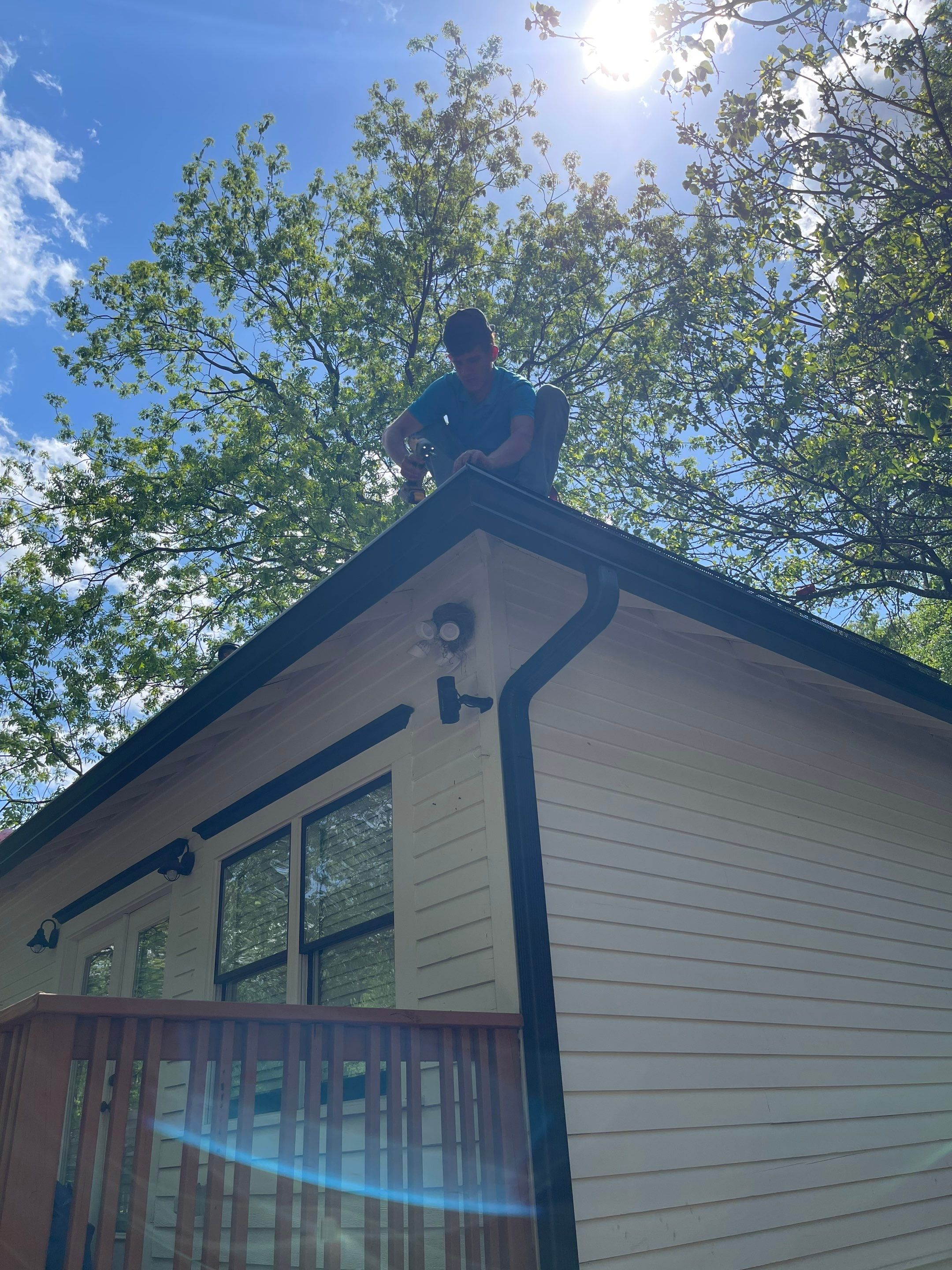 roof replacement and new black gutters by Nailed It Roofing & Remodeling LLC