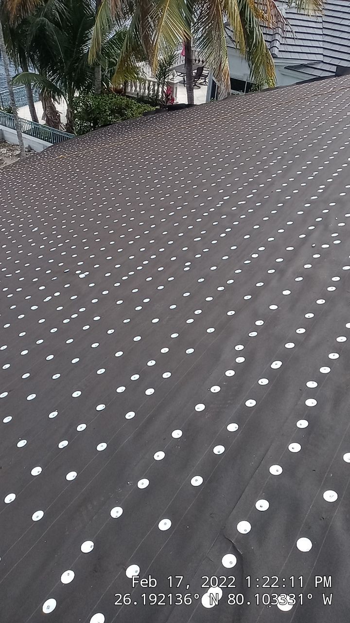Residential Roofing Installation using 1" Nail strip metal roof by BLUES BROTHERS ROOFING