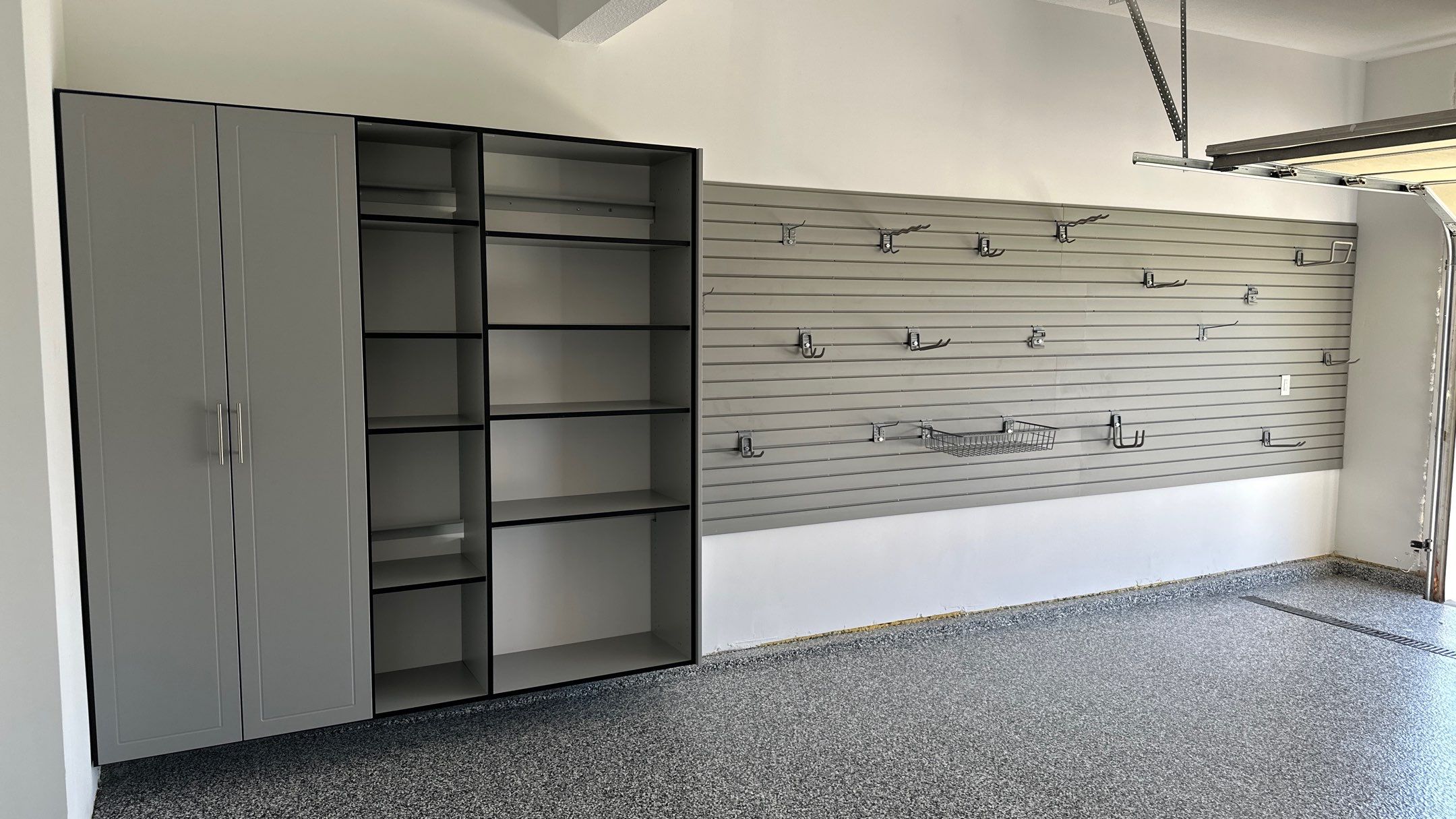 Laura B. garage transformation with a new floor and garage storage  by Banner Garage