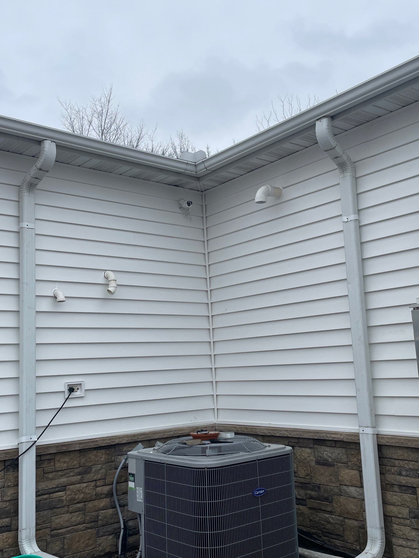 Siding and Stone Installation using Extrerior Porfolio Vinyl Siding and Versetta Stone by EEC  Windows, Siding & Roofing 