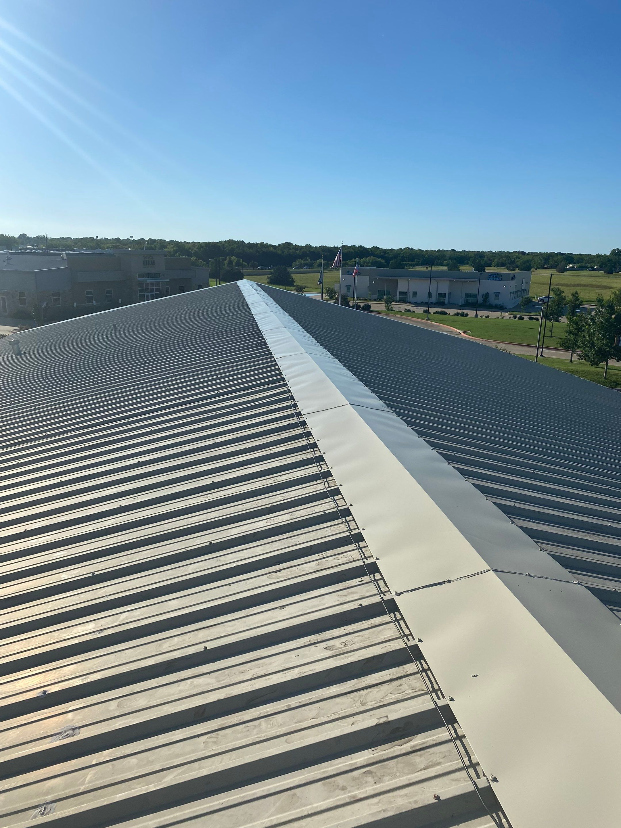 Drainage System Installation and Metal Roof Repairs by Harvey Roofing & Construction