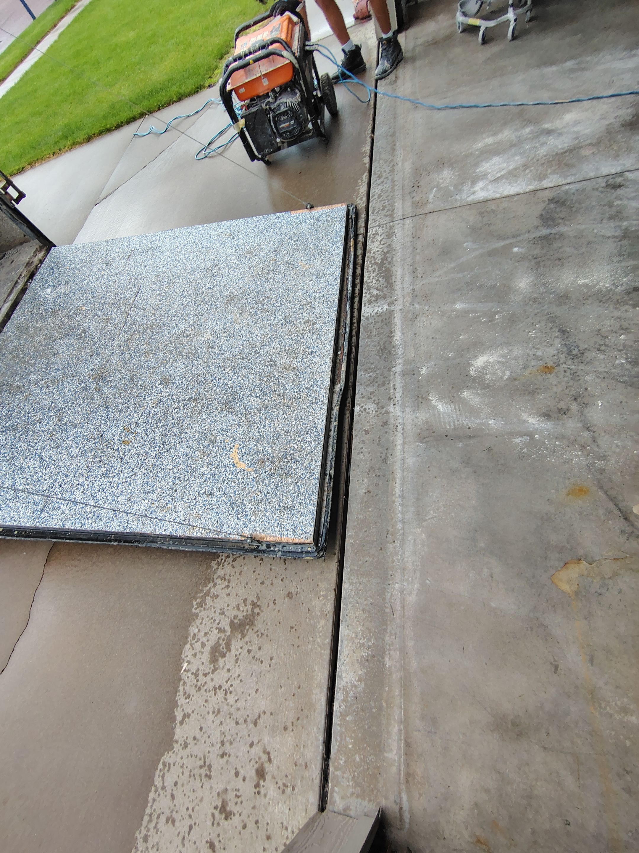 Multi-Car Garage Concrete Coating and Epoxy Finish in Sioux Falls by Select Painting, Coatings & Garage Cabinets