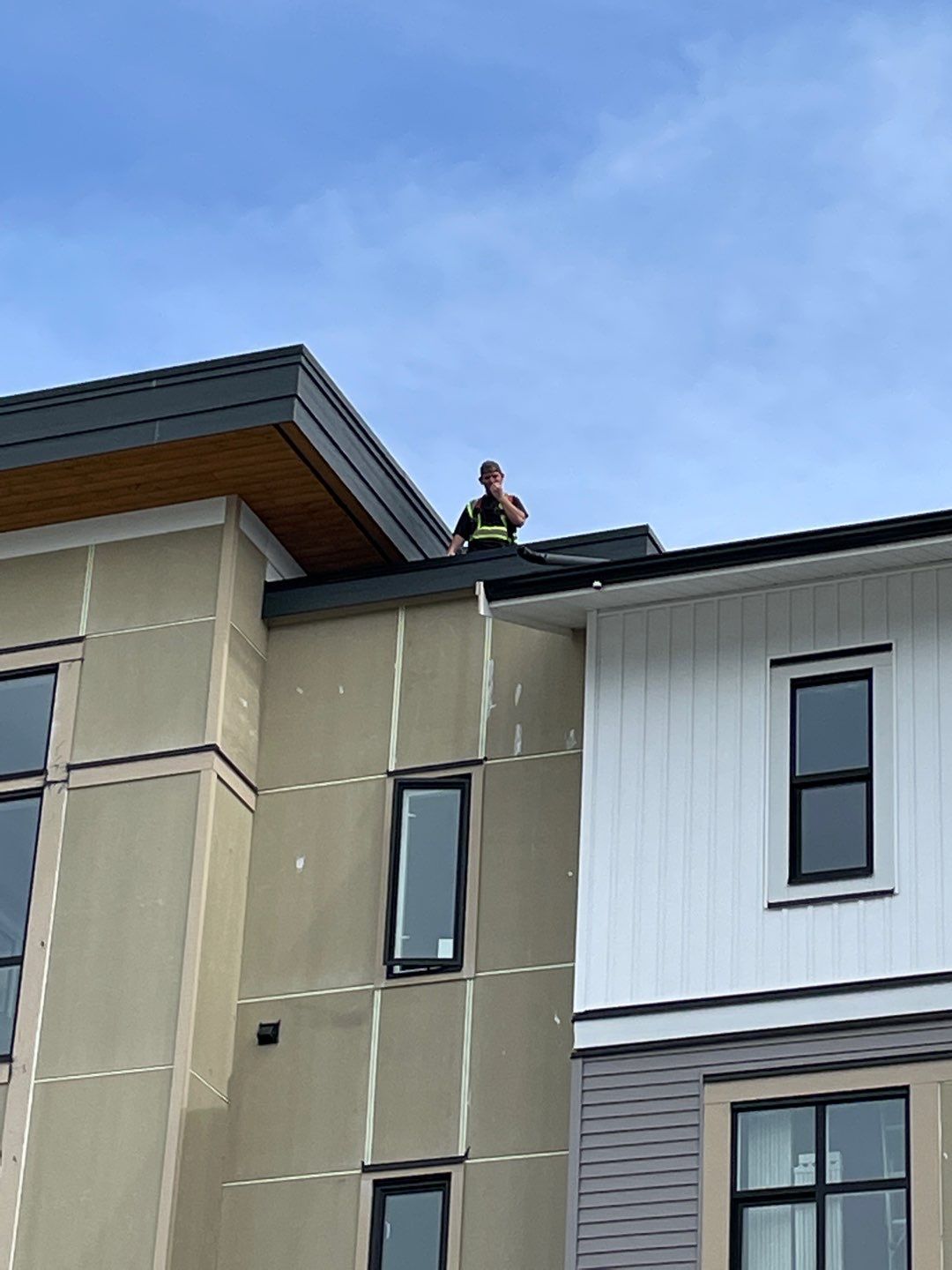 Large apartment with sbs, shingles and prolok metal  by Top Notch Roofing Inc