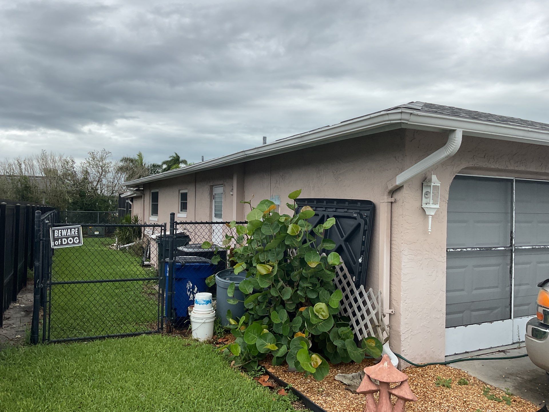White Seamless Gutters and Splash Guards in Fort Myers FL by Gutter Professor by Gutter Professors