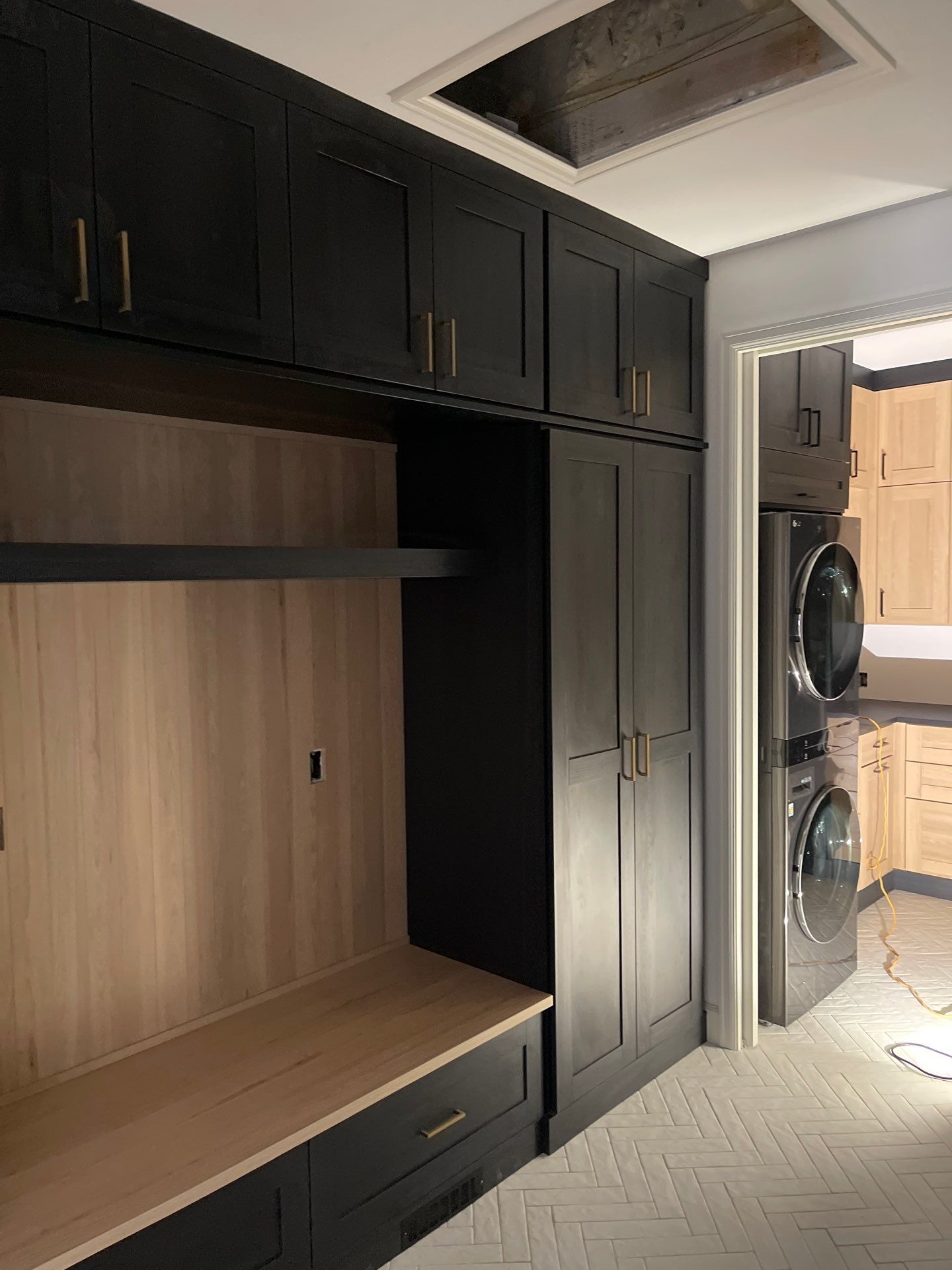 Two-Tone Closet with matching Mudroom + Laundry Room by Concept 32, Inc.