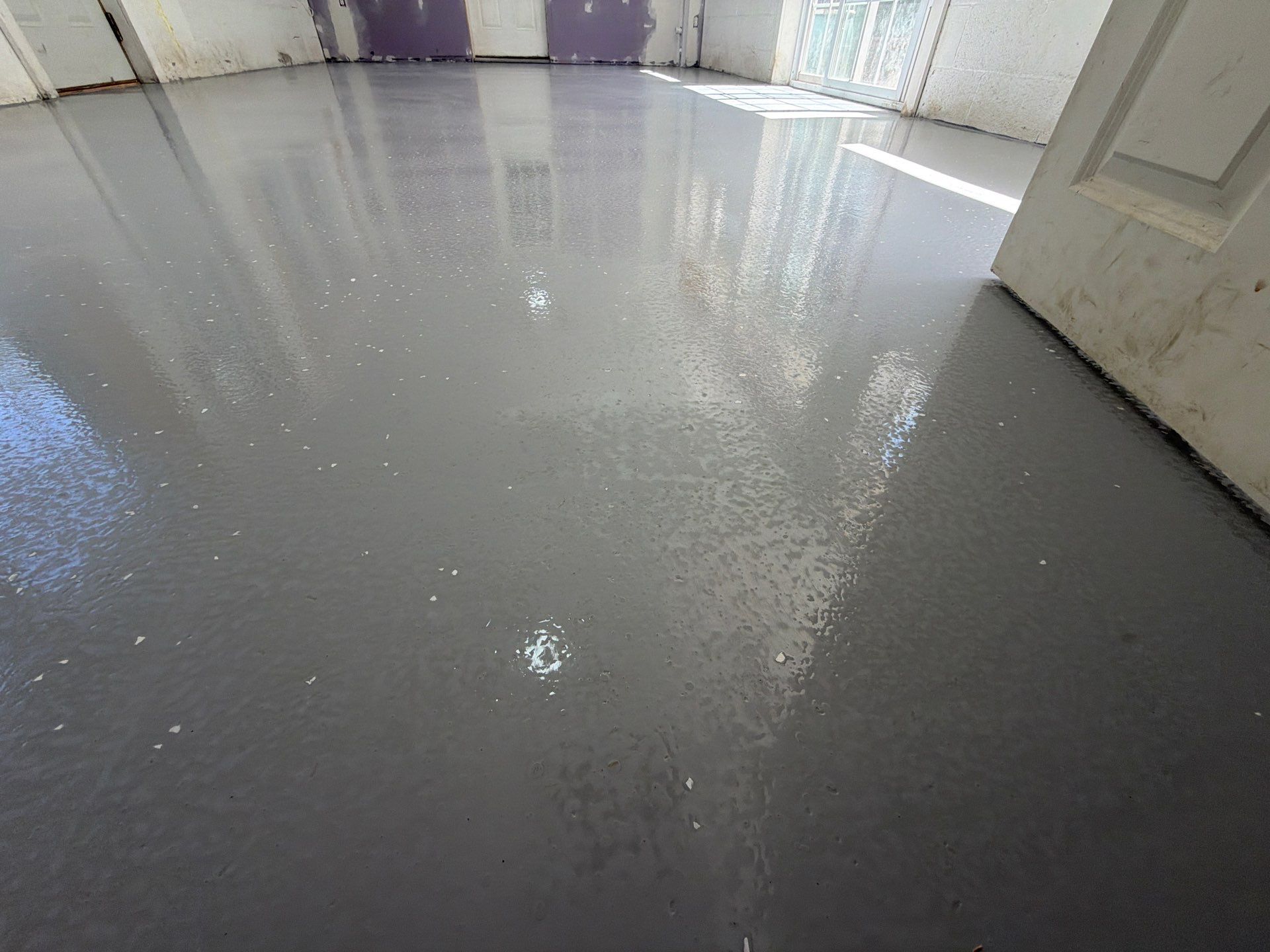Grey Epoxy Flake Floor Installation for a Muskegon Sunroom by Gordon Painting