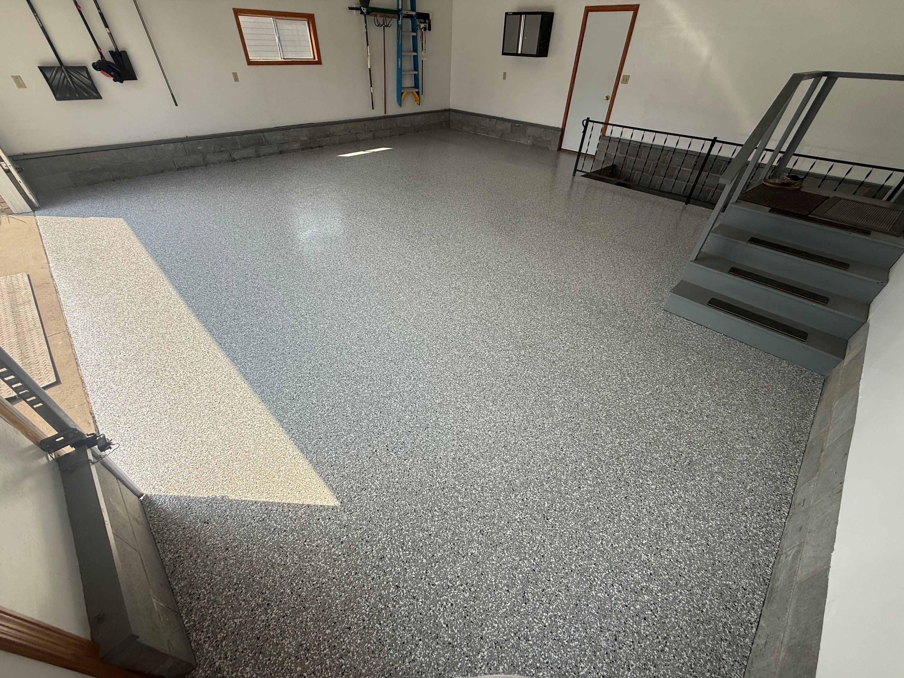 Feather Grey Garage Floor Coating and Concrete Restoration in Mitchell by Select Painting, Coatings & Garage Cabinets