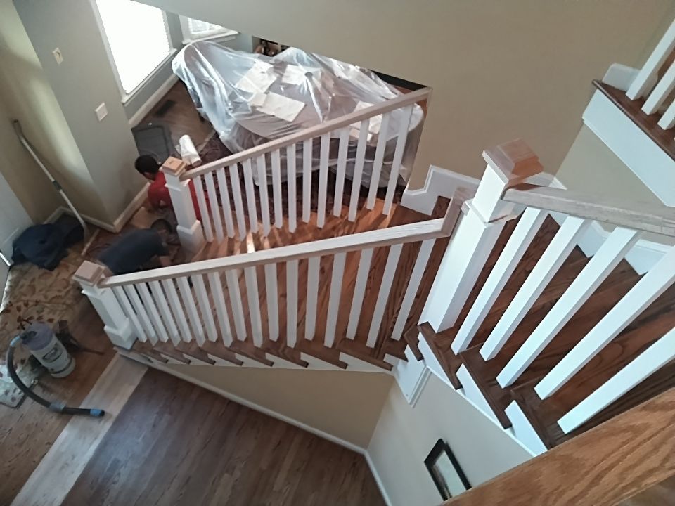 Stairway Installation using Red oak modern railings by House Custom Carpentry, LLC