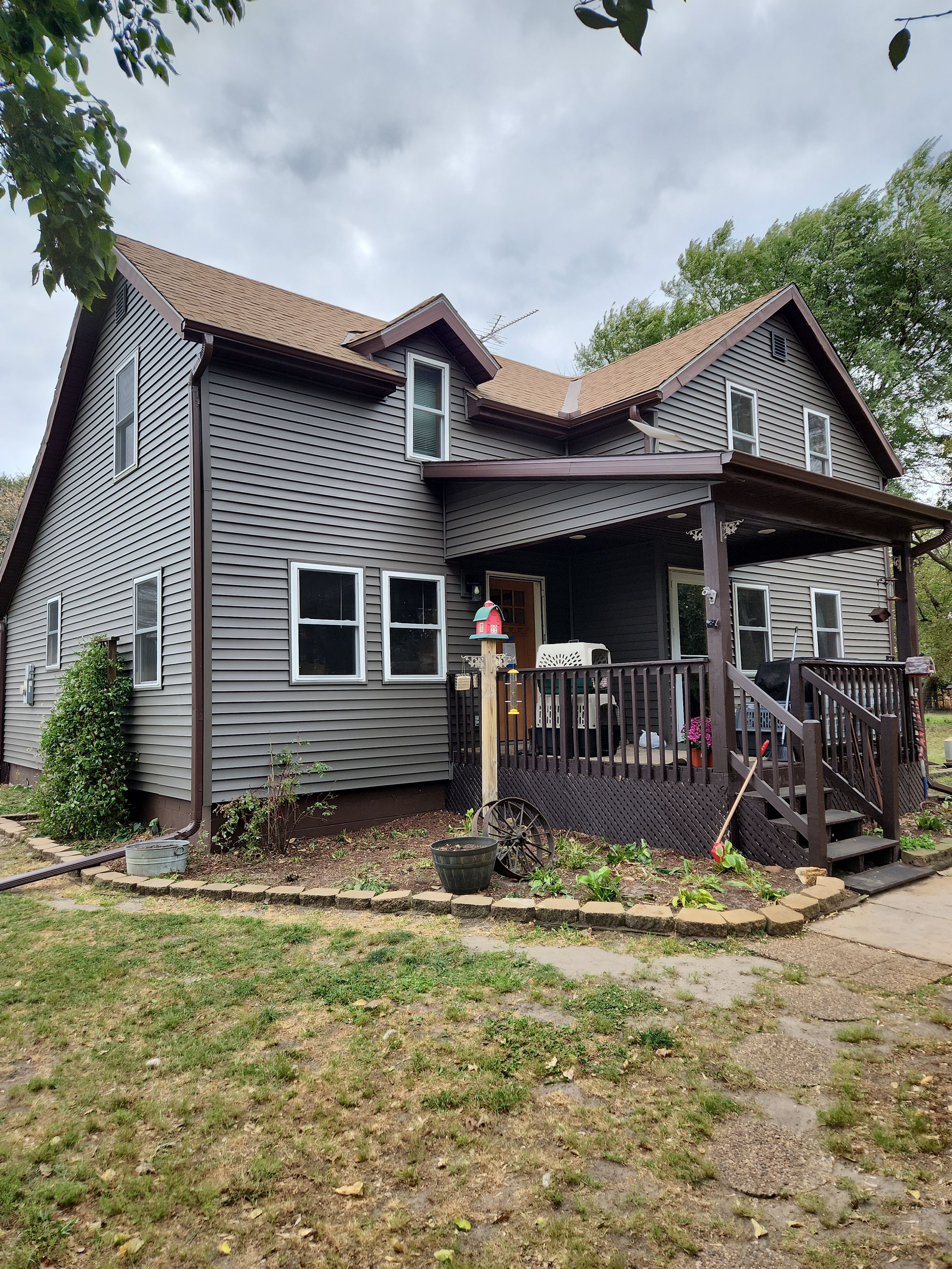 Royal Granite Siding Replacement & Brown Seamless Gutters by Next Level Seamless Gutters / Exteriors Inc.