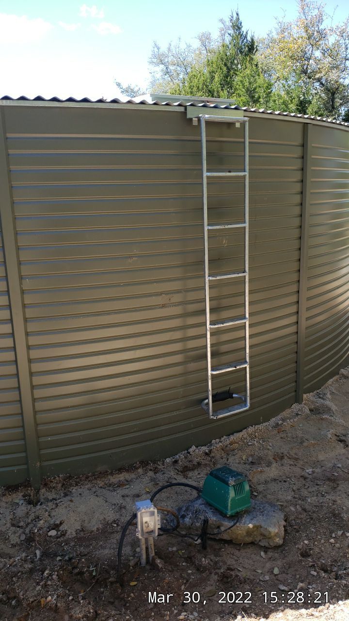 30K gallon mangrove green tank for residential rain water harvesting, Dripping Springs, TX by Hill Country Rain Water
