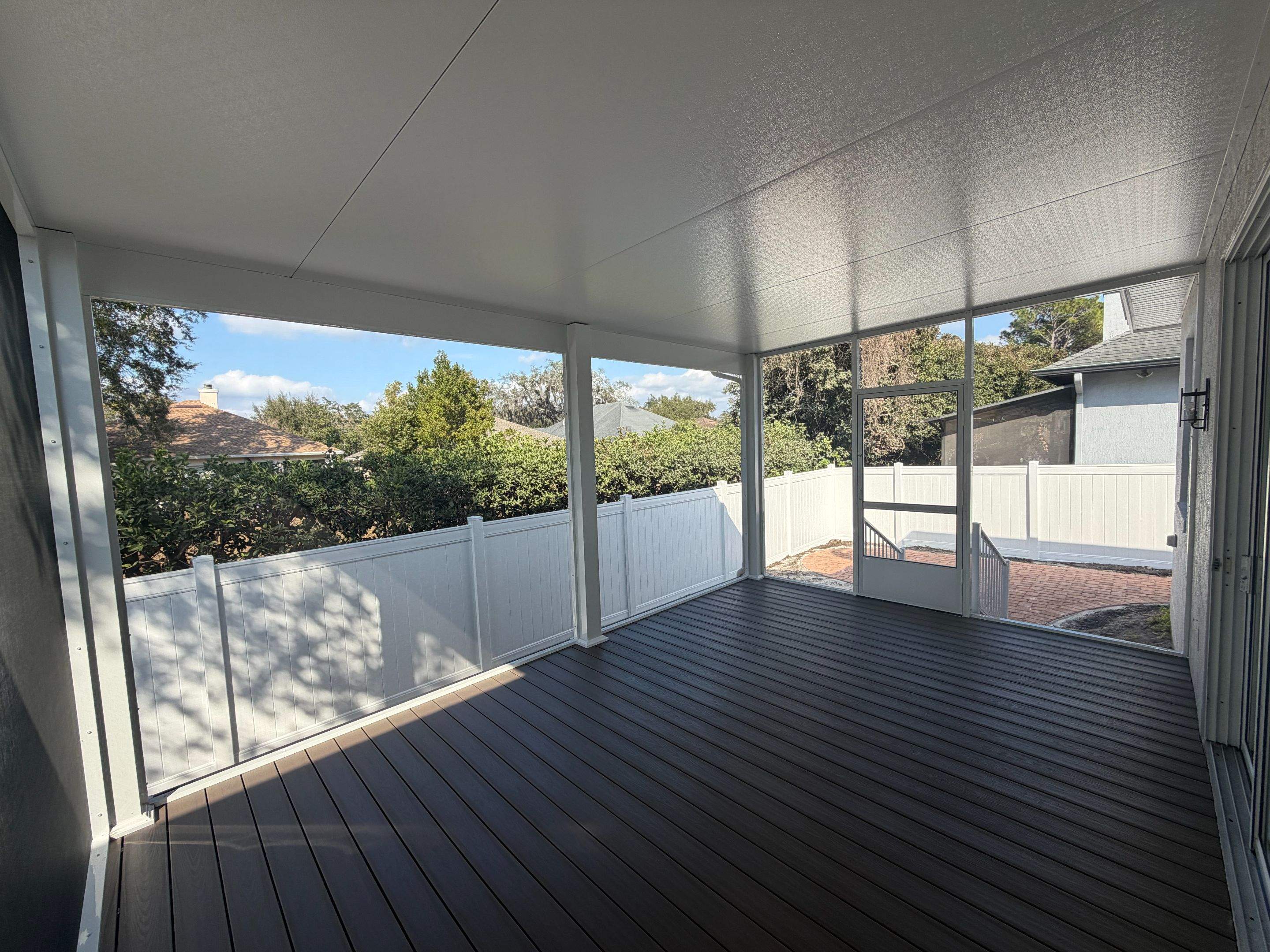 The Complete Backyard Retreat: Insulated Screen Room & Composite Deck by Orlando pergolas