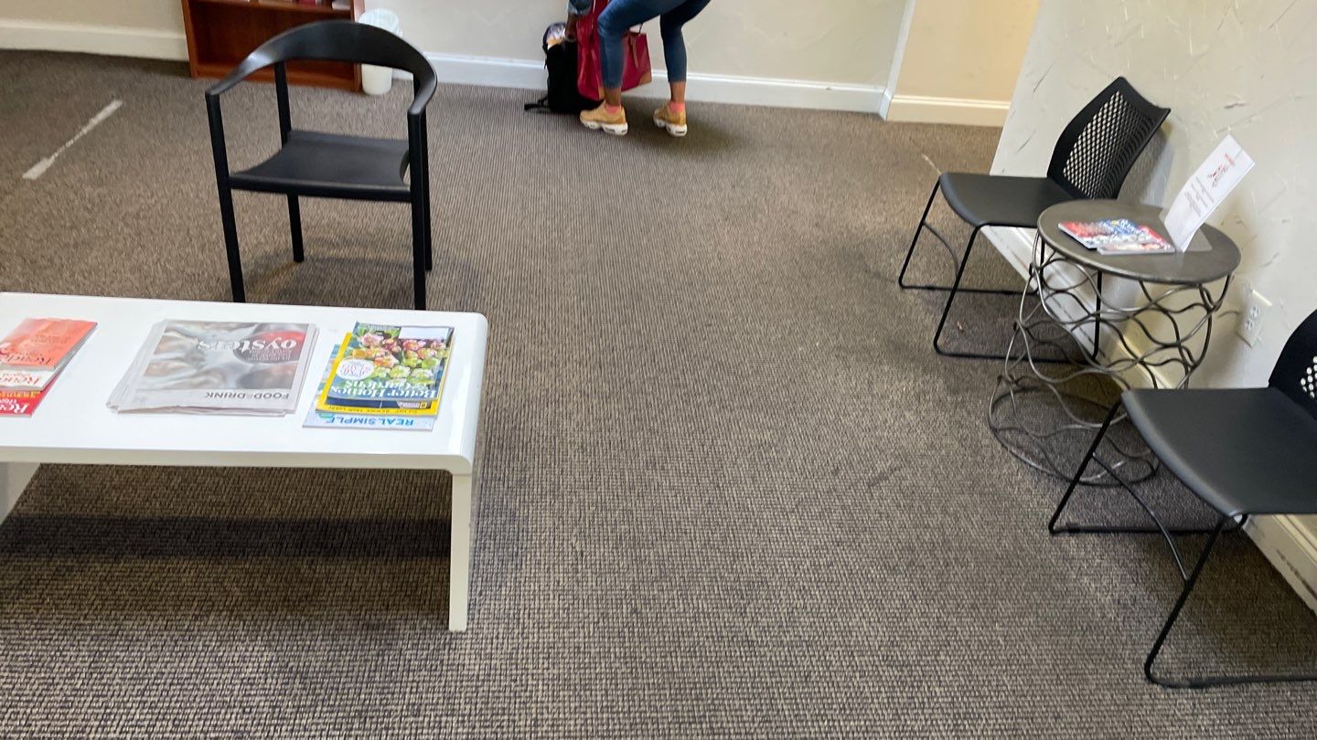 Office Remodel from Worn Out Carpet to Sleek Glued Down LVP by Footprints Floors of Coastal Carolina