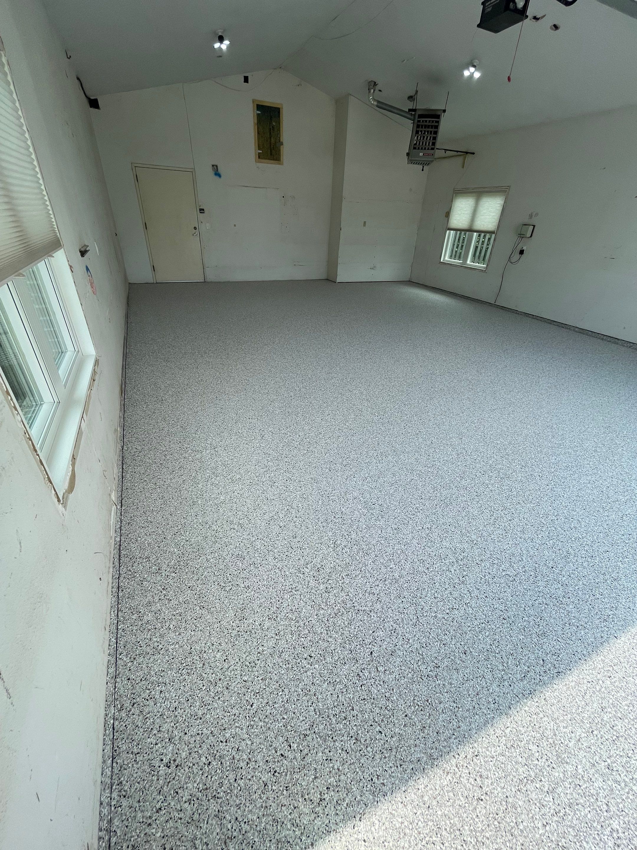 Coyote Flake Concrete Coating for Sioux Falls Garage by Select Painting, Coatings & Garage Cabinets