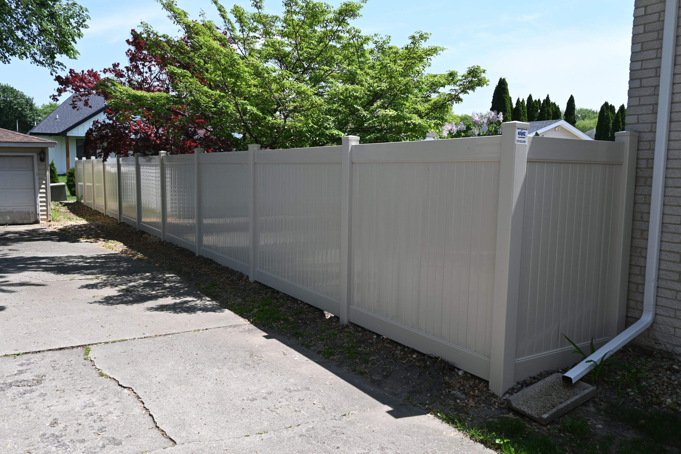 Vinyl Fence Installation in Backyard by Kraz Construction