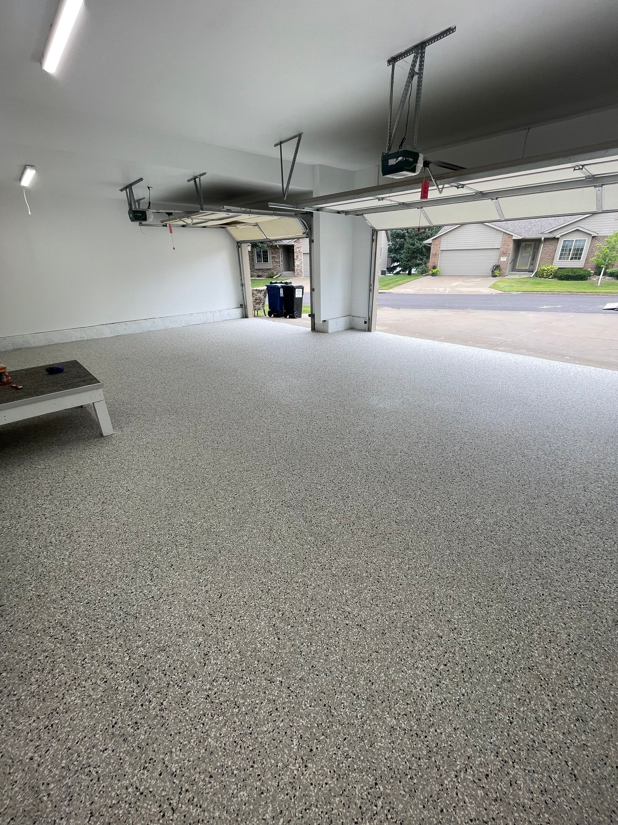 Cabin Fever Garage Floor System in Sioux Falls by Select Painting, Coatings & Garage Cabinets