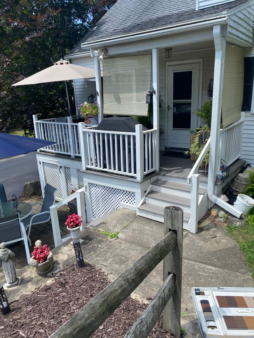 Front deck replacement, Trex tropical Island mist boards and matching cocktail rail, Lattice bottom with access door by DiGiorgi Roofing and Siding Inc