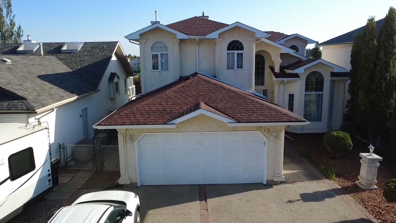 Monaco Red on IKO Dynasty by 2thetop Roofing