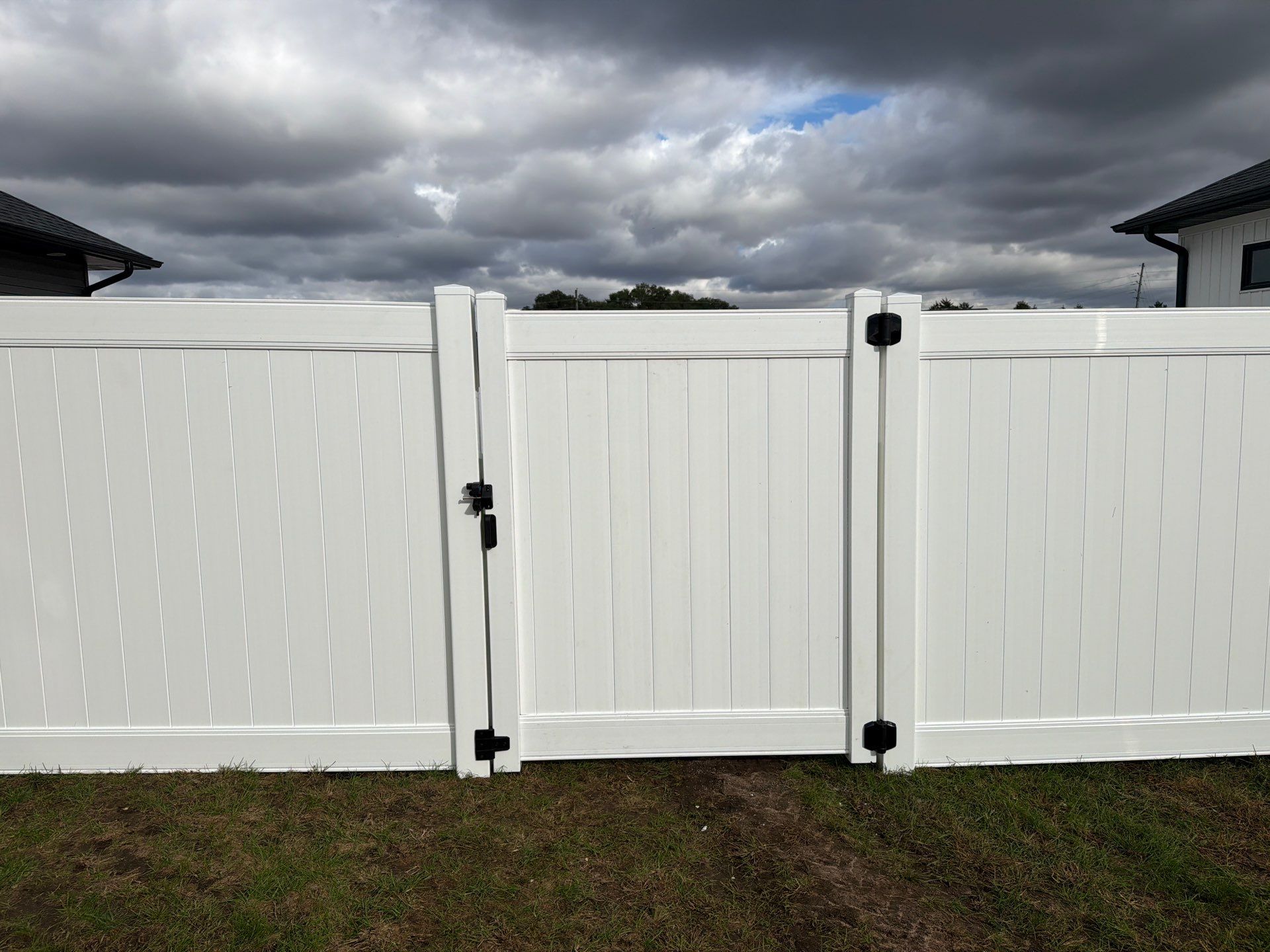 Residential White Vinyl Privacy Fence Installation in Janesville by Perfect Picket Fence and Stain