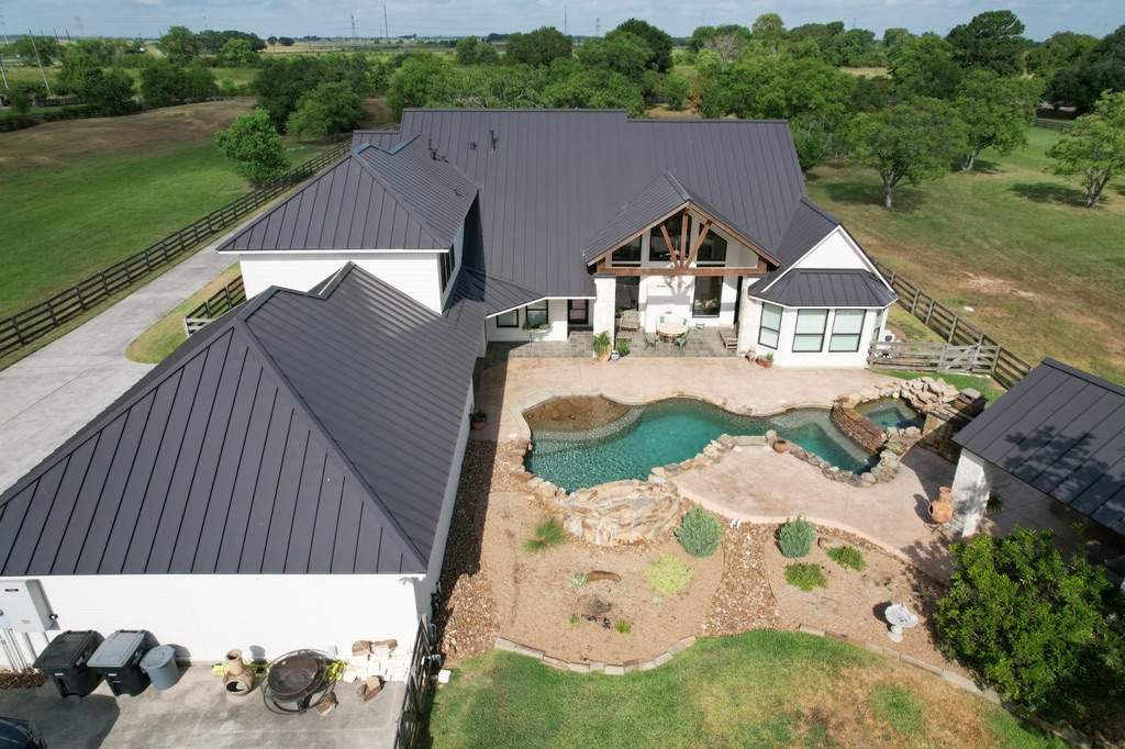 Residential Roofing Installation using Stamding Seam Metal by STX Roofing
