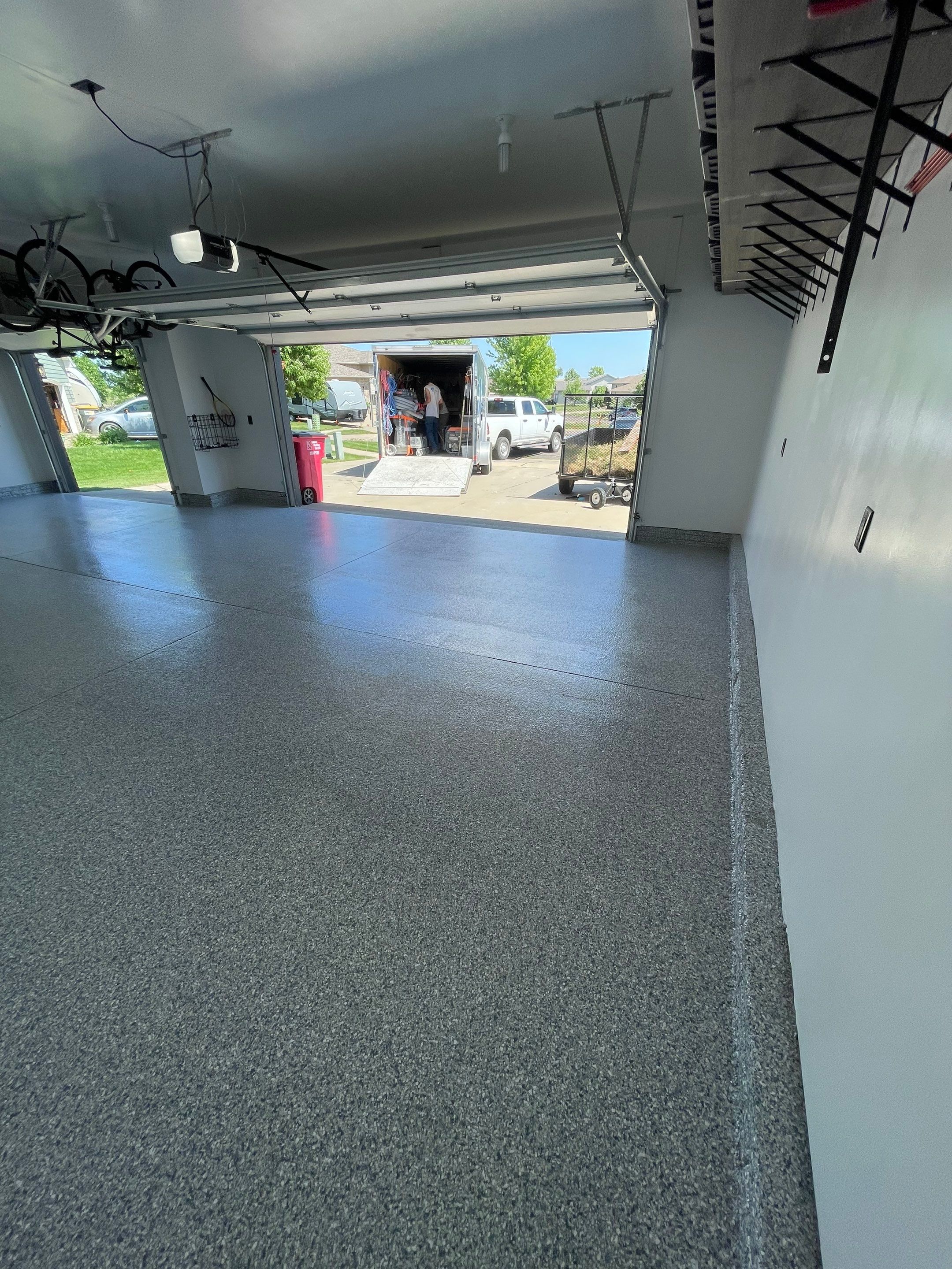 Tidal Wave Flake Garage Floor Installation in Sioux Falls by Select Painting, Coatings & Garage Cabinets