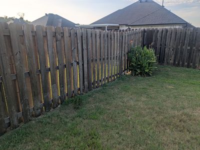 Touching Up a Fence in Whitehouse