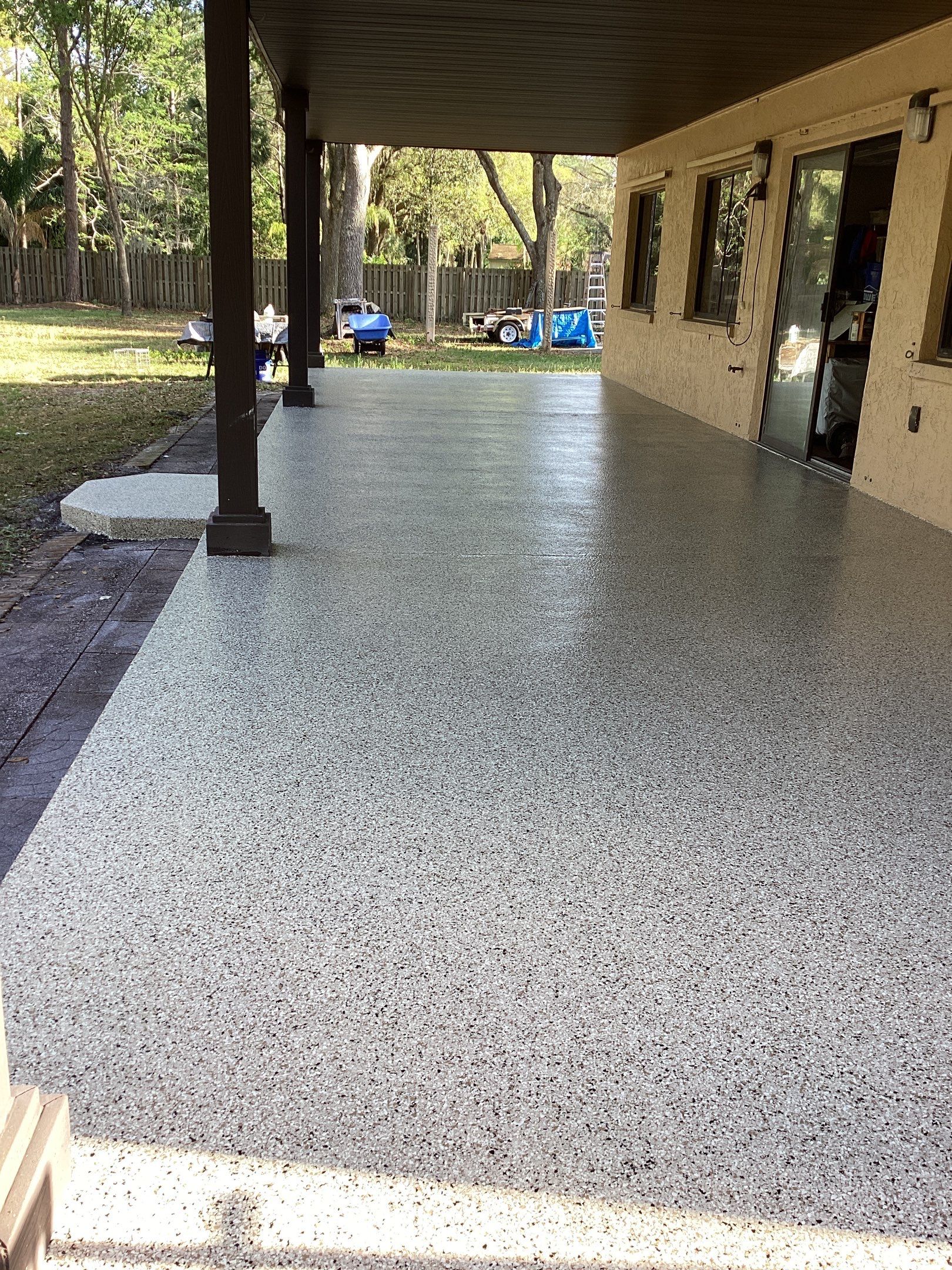 Patio using Pebble Beach by Amvet concrete coatings llc