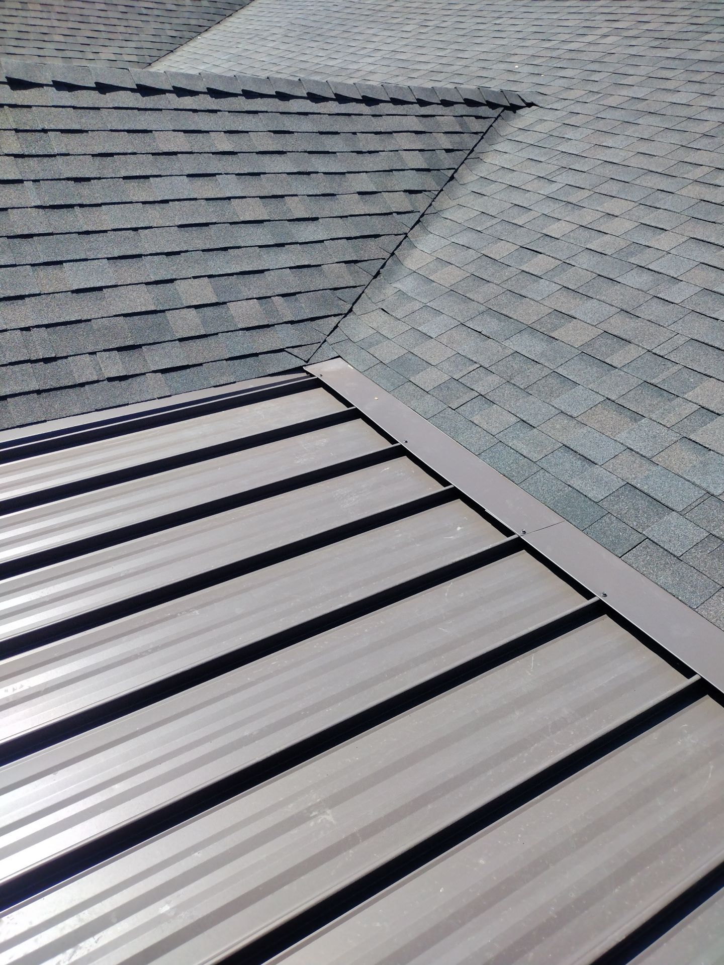 Residential Roof Replacement with Metal Accents by Orezona Building & Roofing Company, Inc.