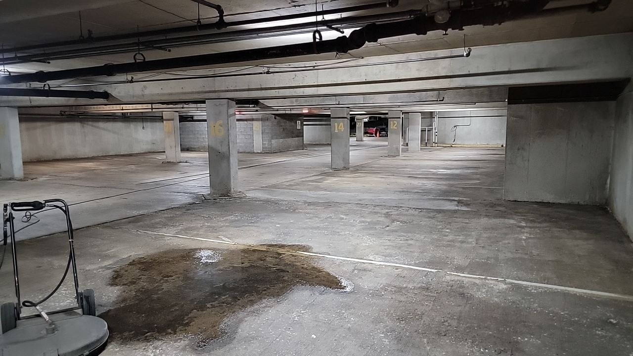 Parking garage using Hot water by Northern Power Washing LLC.