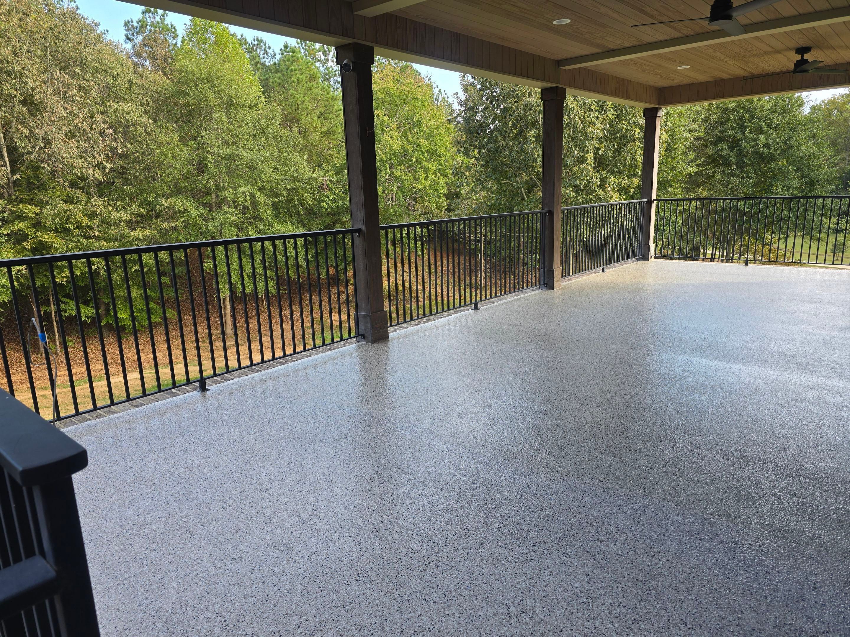 Garage & Porch Using Creekbed & Shoreline by Elite Floor Solutions