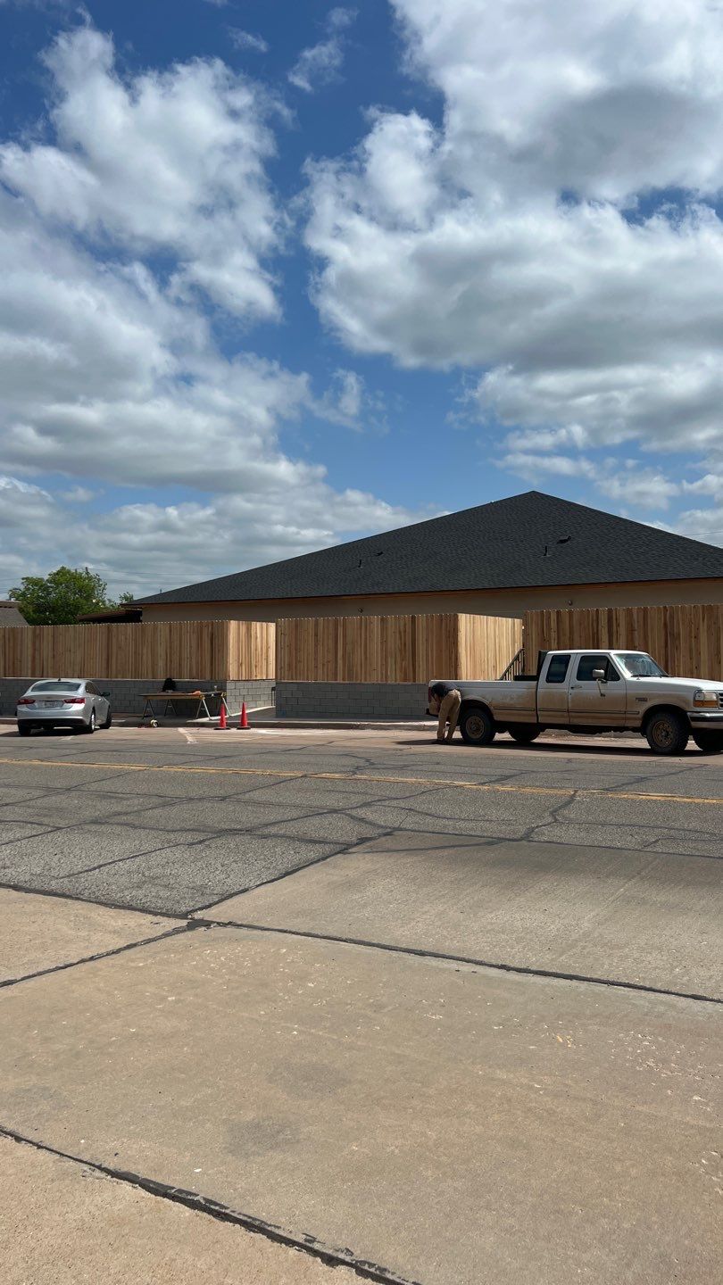 Cedar Fence using Cedar Pickets and Metal Poles by Clays Services Inc