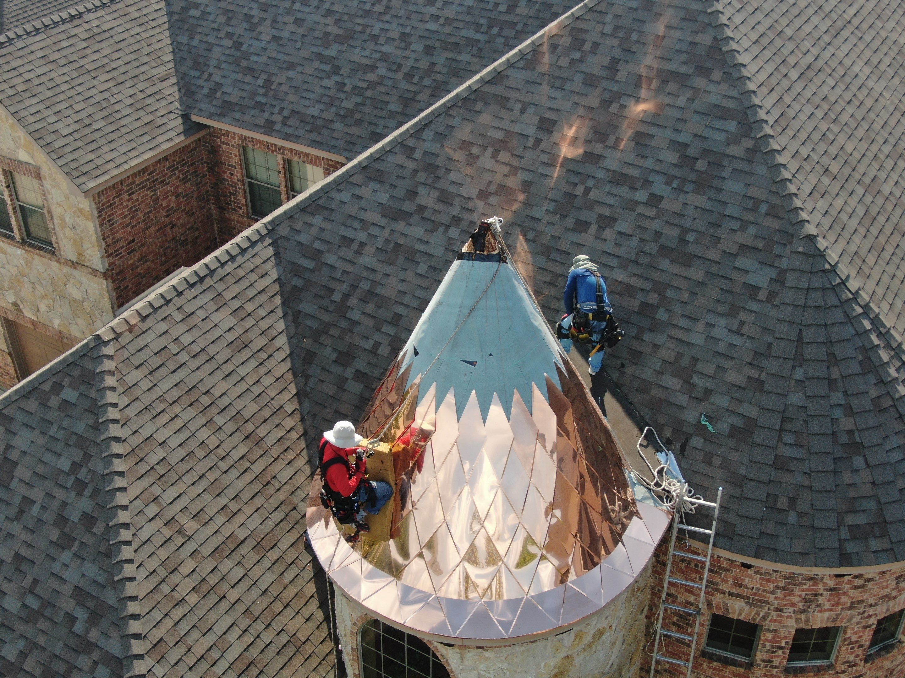 Installing Custom copper turret and Malarkey Vista Class 4 shingles Hail Damage Upgrade by Becker Roofing and Exteriors