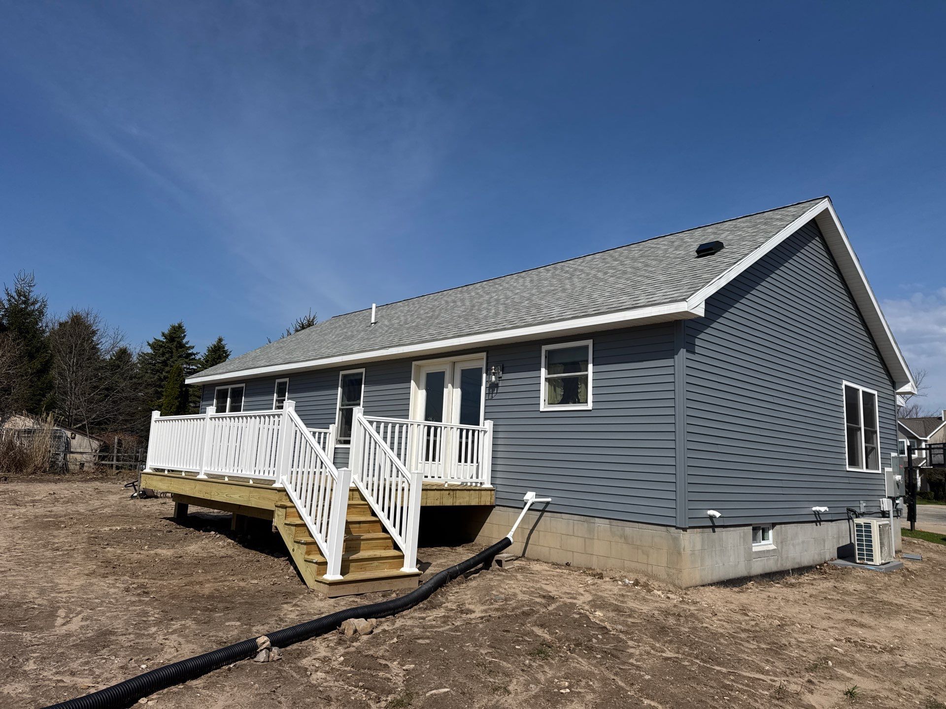 Gutter System Installation for New Home Construction in Petoskey by Rainbow Seamless Systems