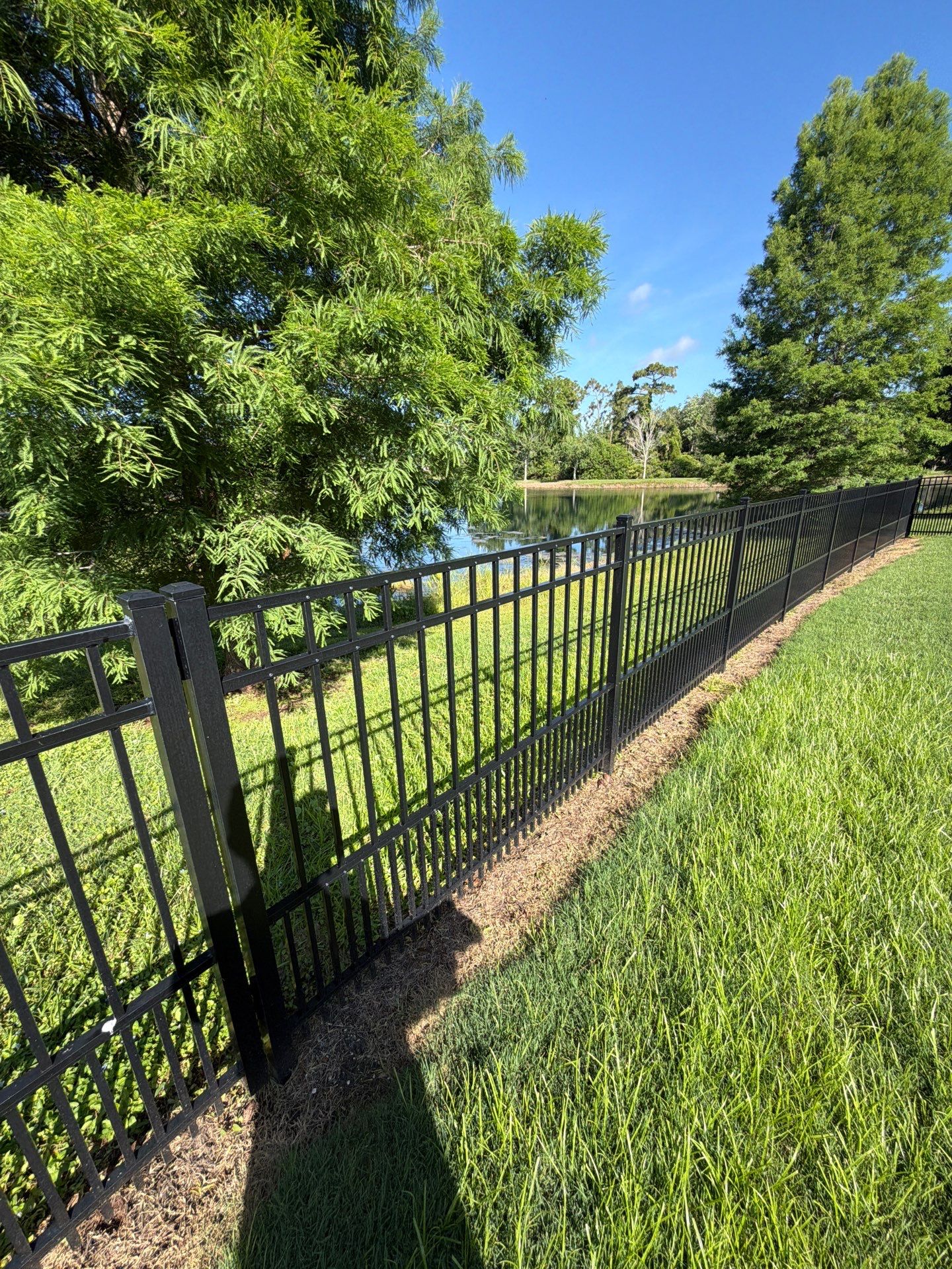 customer with puppy picket aluminum  by H&Y Fence