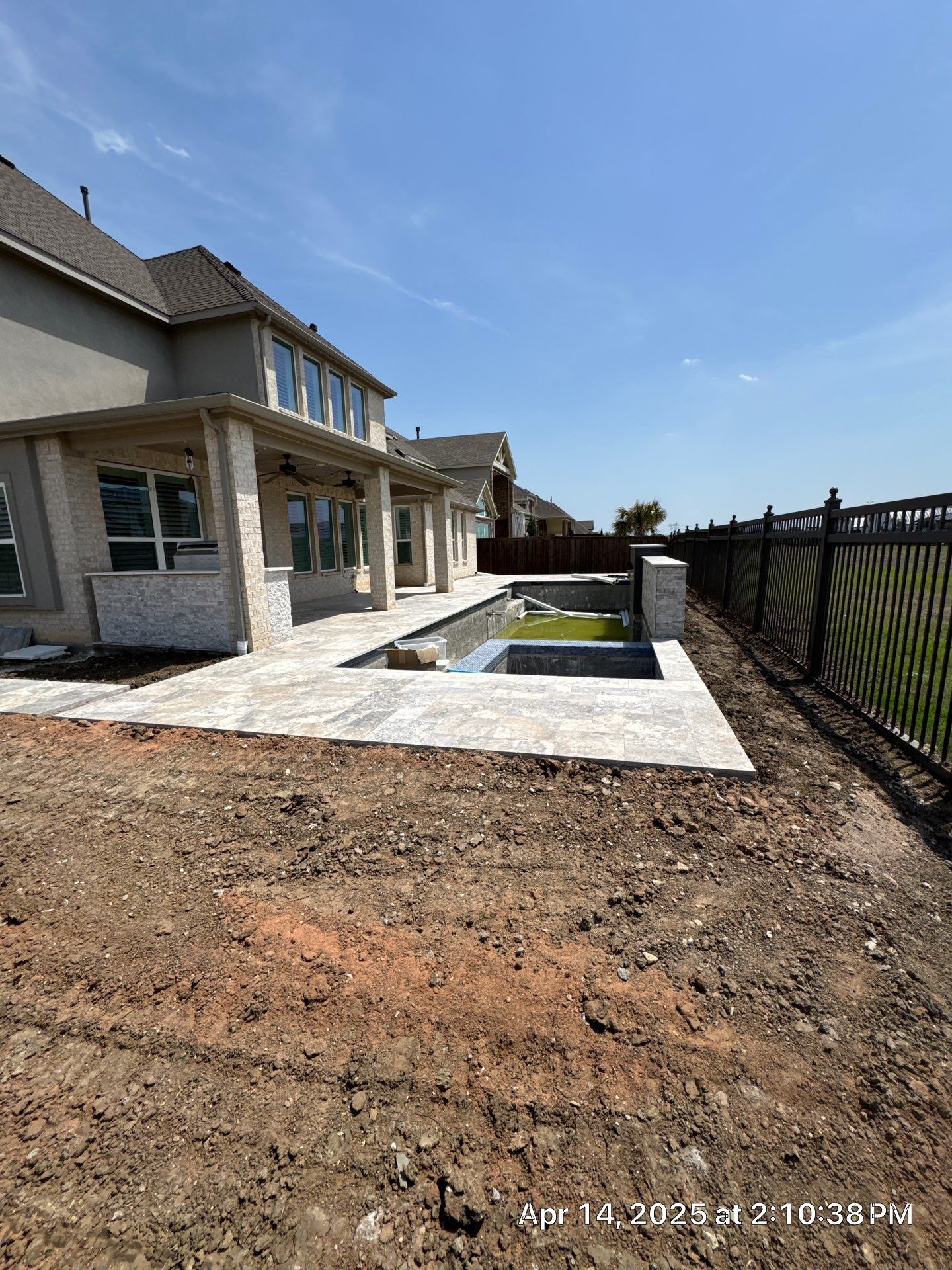 Geometric Pool with Raised Stone Scupper Wall and Outdoor Kitchen by Pinnacle Pools and Spas - DFW