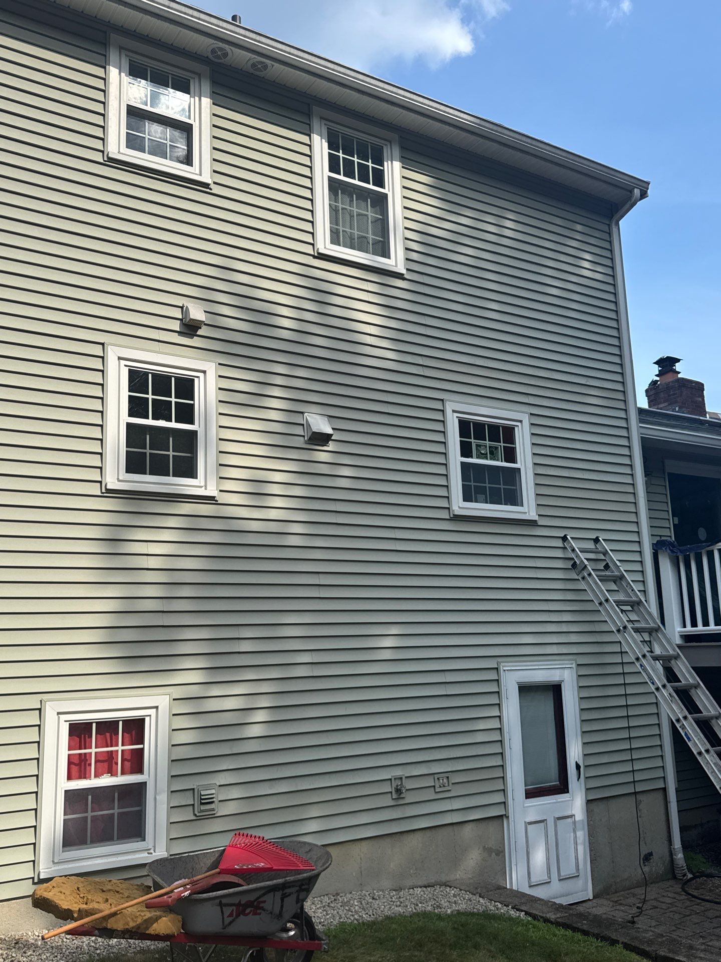 Complete Roof Replacement with Chimney Flashing, Gutter Guard System, and Vinyl Siding Repairs by Mighty Dog Roofing of Greater Middlesex County